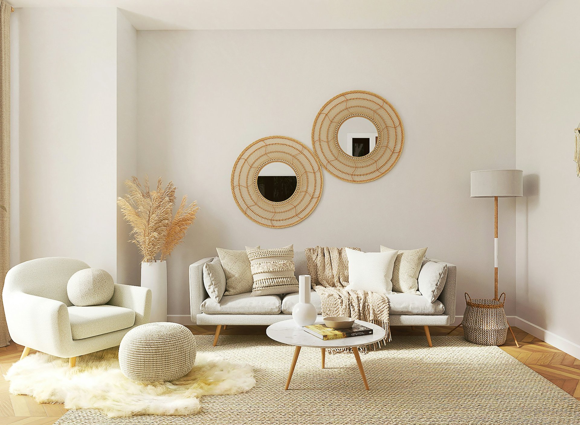 Modern boho living room featuring a grey sofa, woven wall mirrors, and neutral decor.