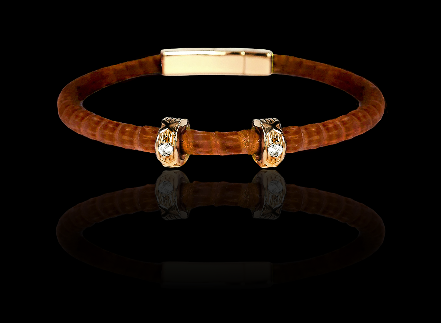 Luxury brown leather cord bracelet with gold accents and crystal studs on black background.