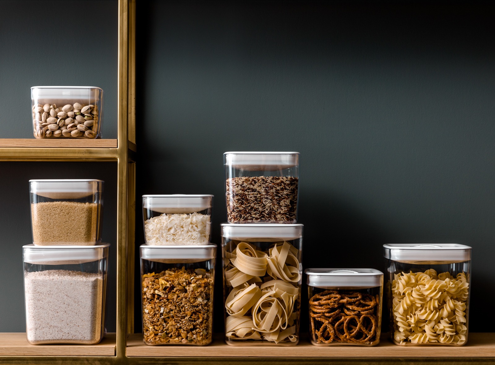 Food product photography - a shelf with several containers of food and nuts