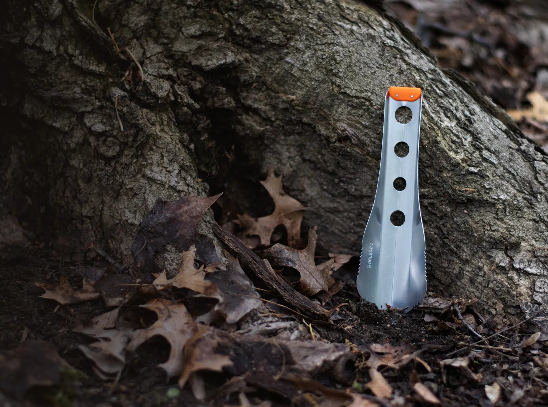boglerco trowel leaning against tree root