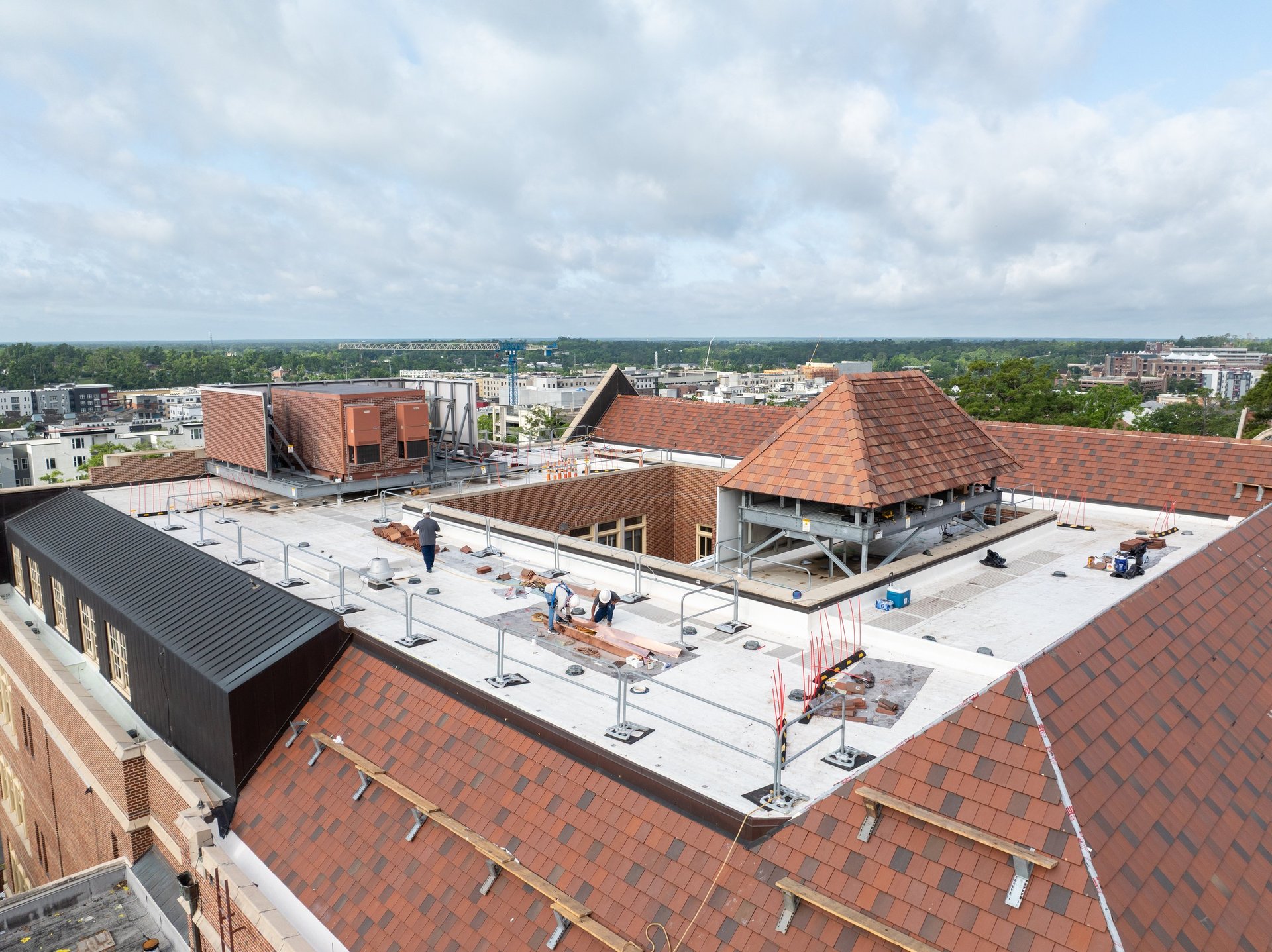 Workers replacing a roof
