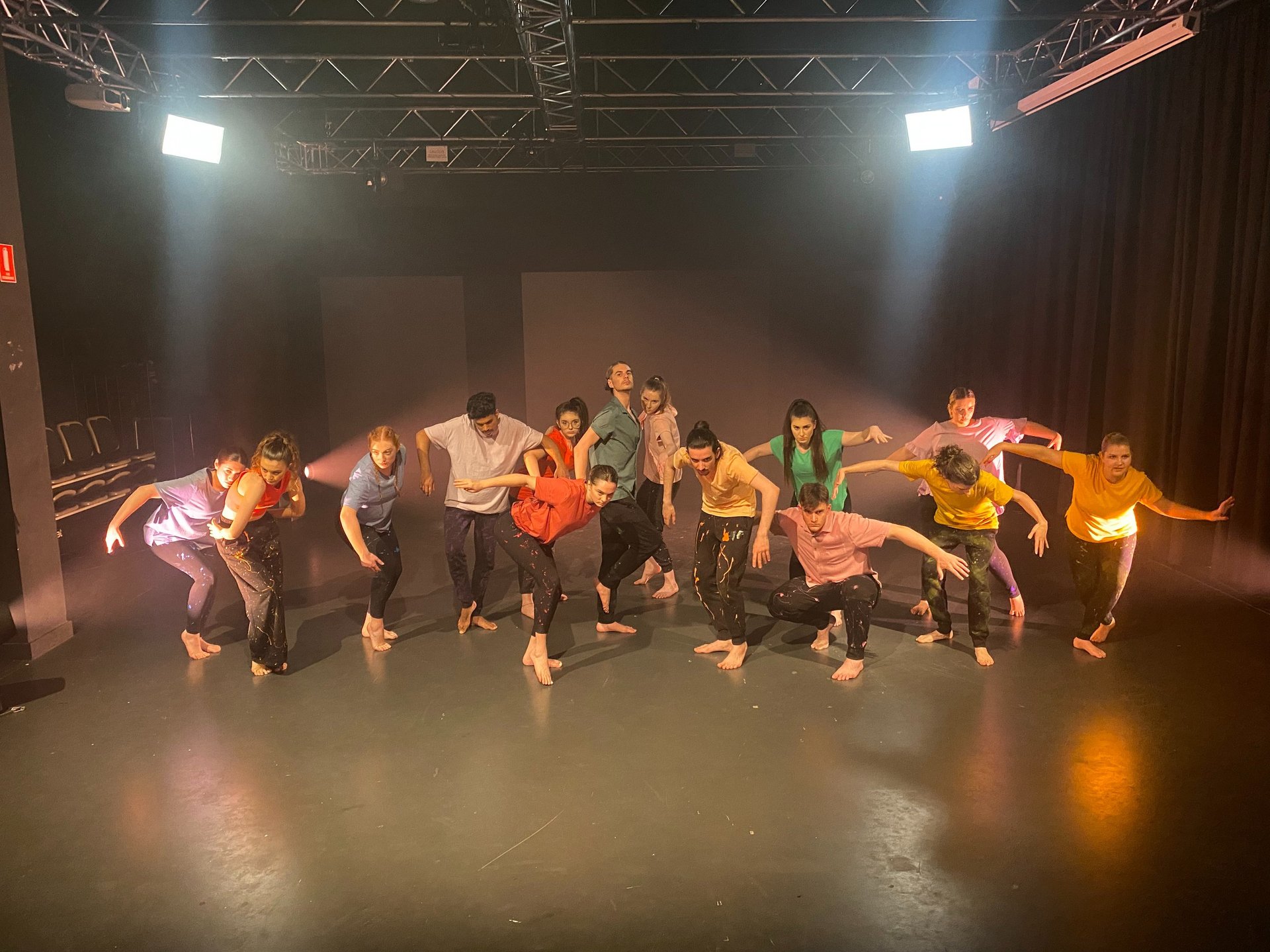 a group of people standing around a stage