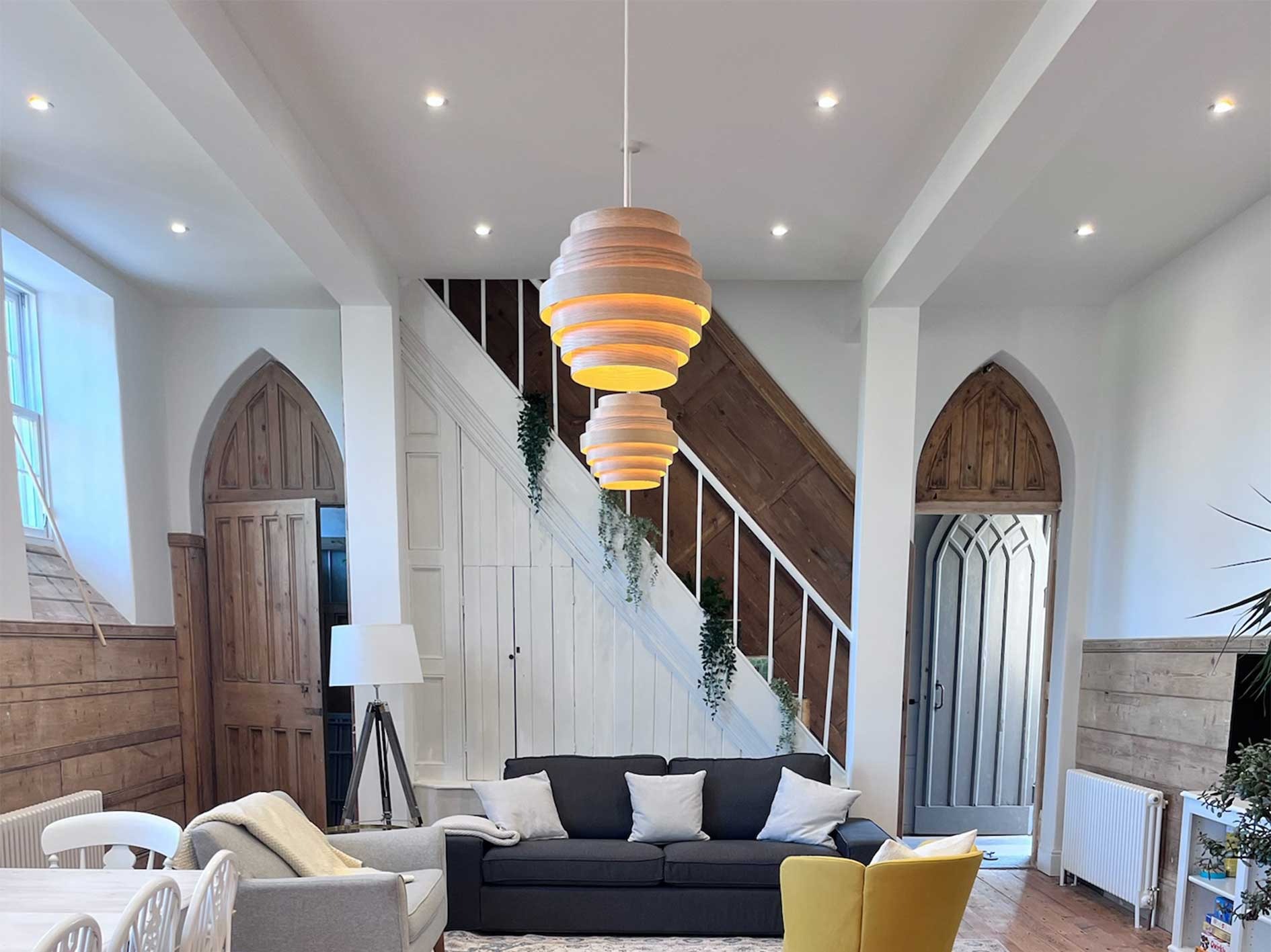 Spacious living area at The Church Rooms holiday let in Witheridge, Devon, featuring original arched