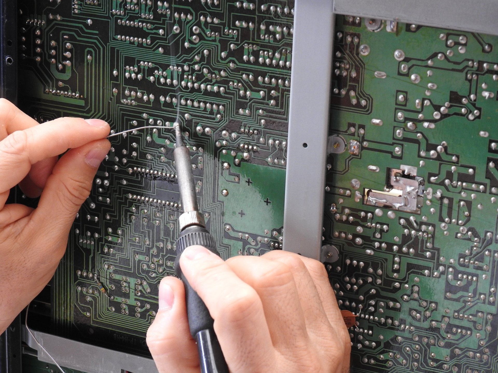 Soldering a board. Repairing audio electronics. 