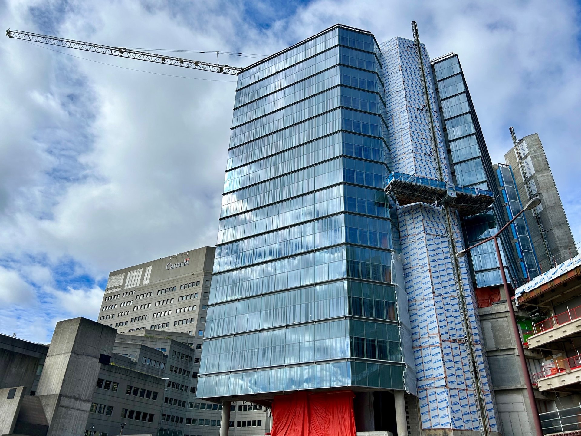 a building with a crane in the background