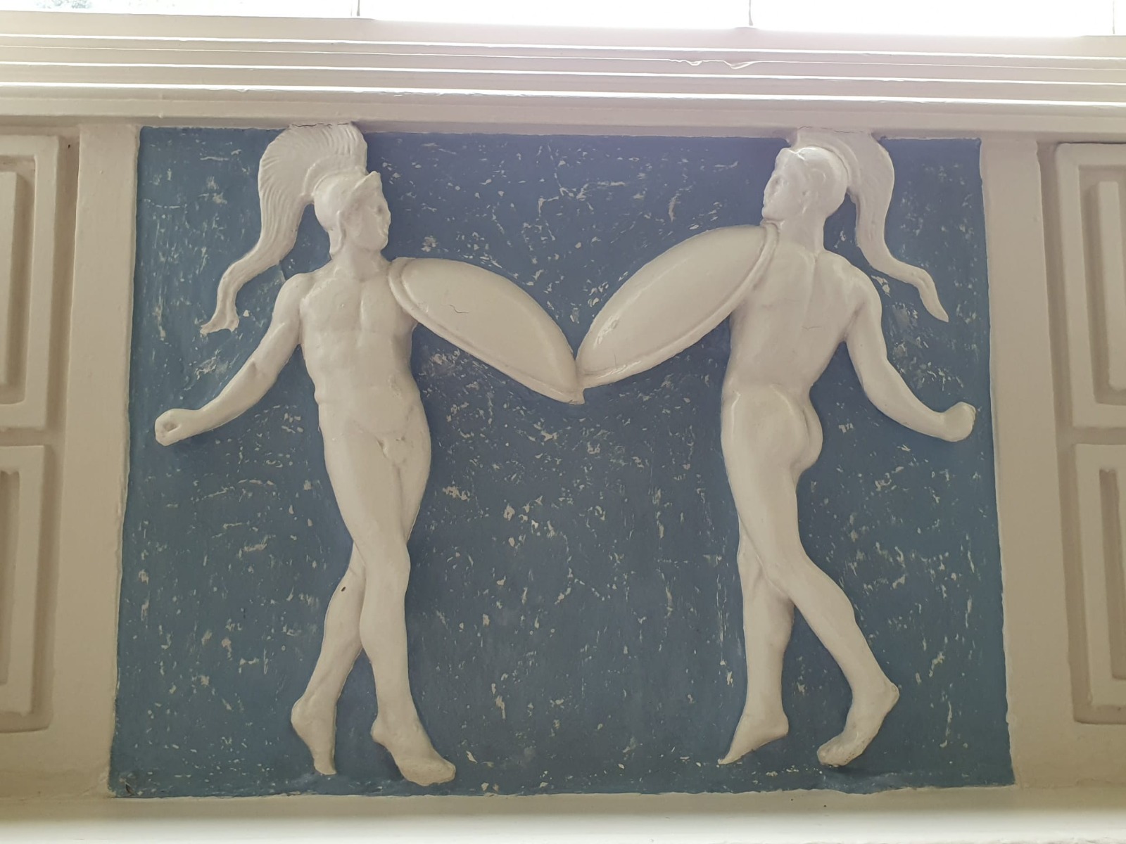 Two dancers depicted in the plaster decoration at Braxted Park