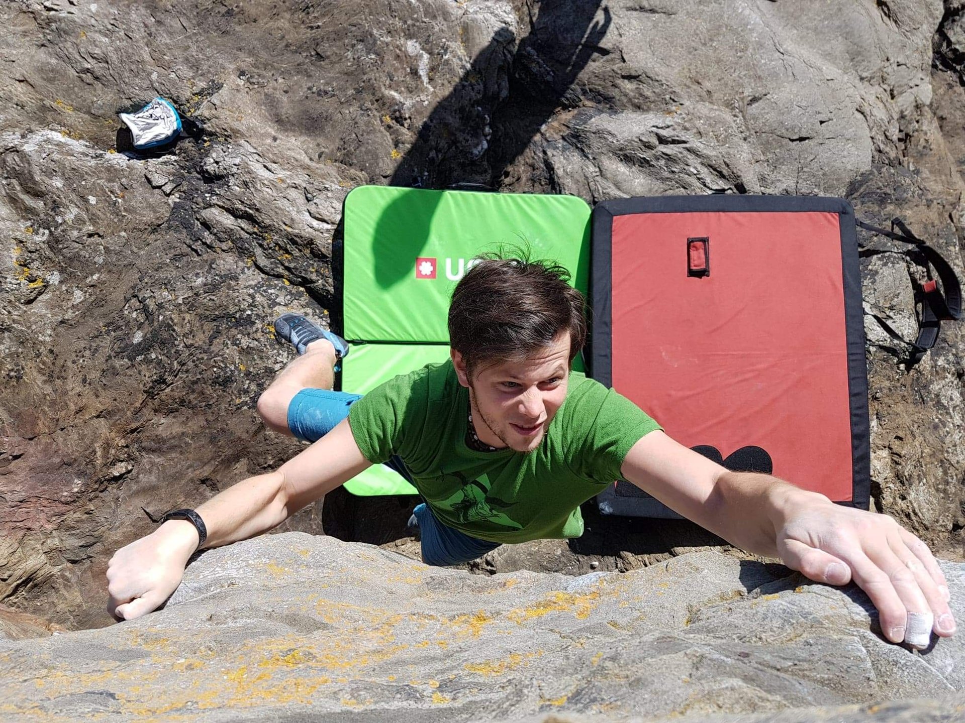 a man bouldering on a rock