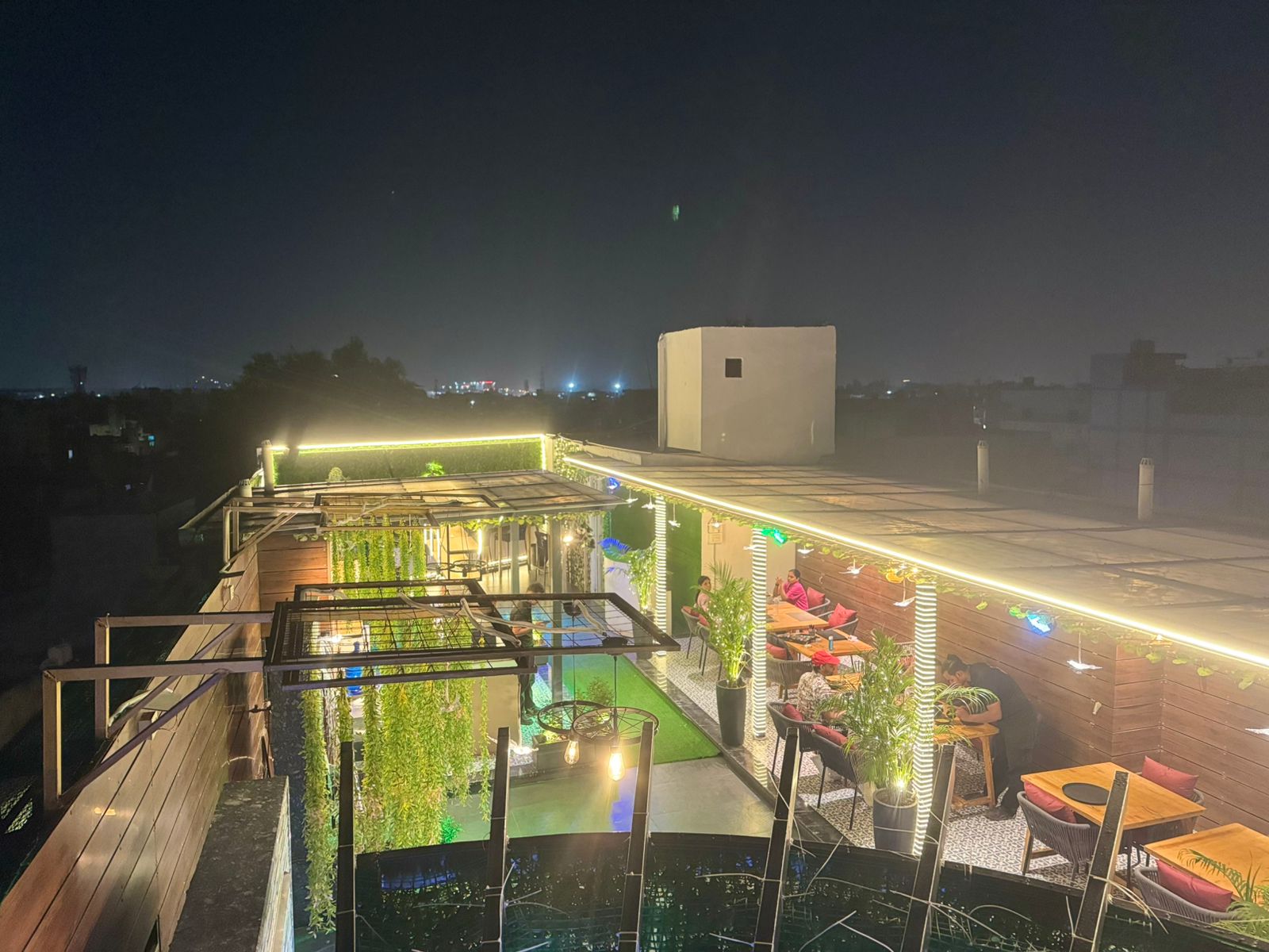 a rooftop bar with a view of a rooftop