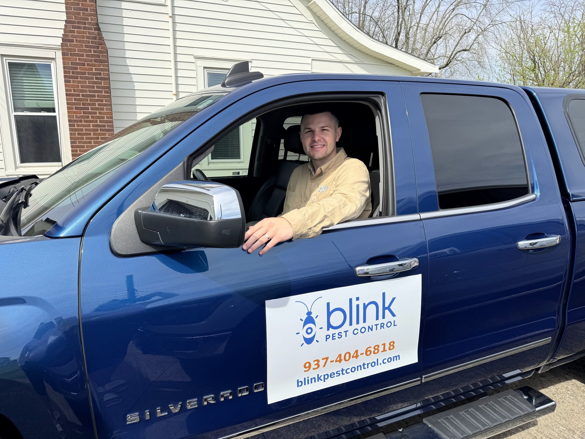 Pest control technician in service truck