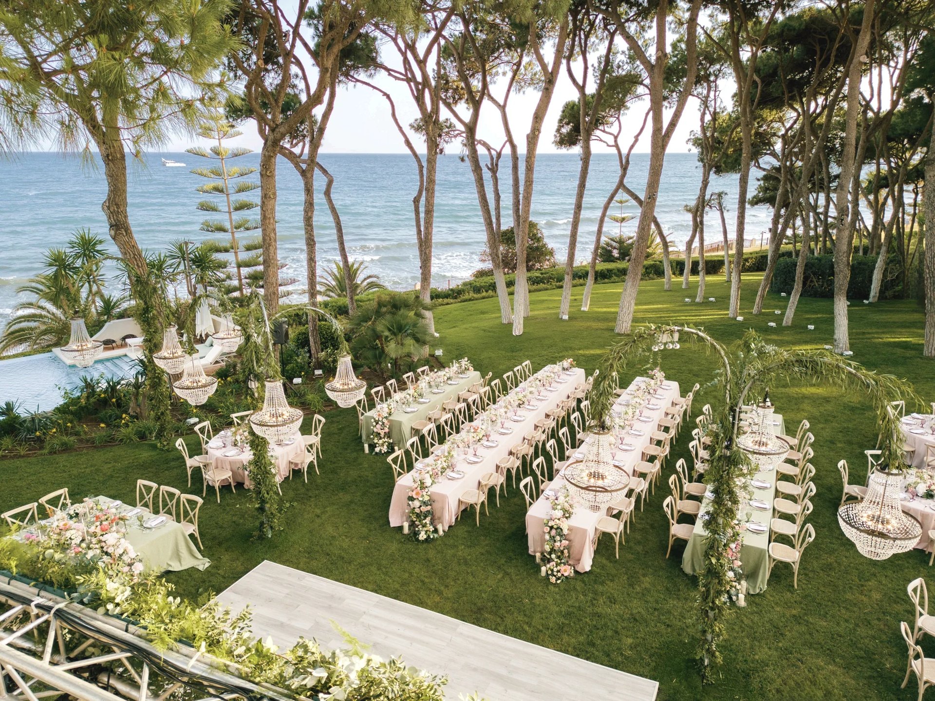 Aerial view of beachfront gala dinner setup in Marbella
