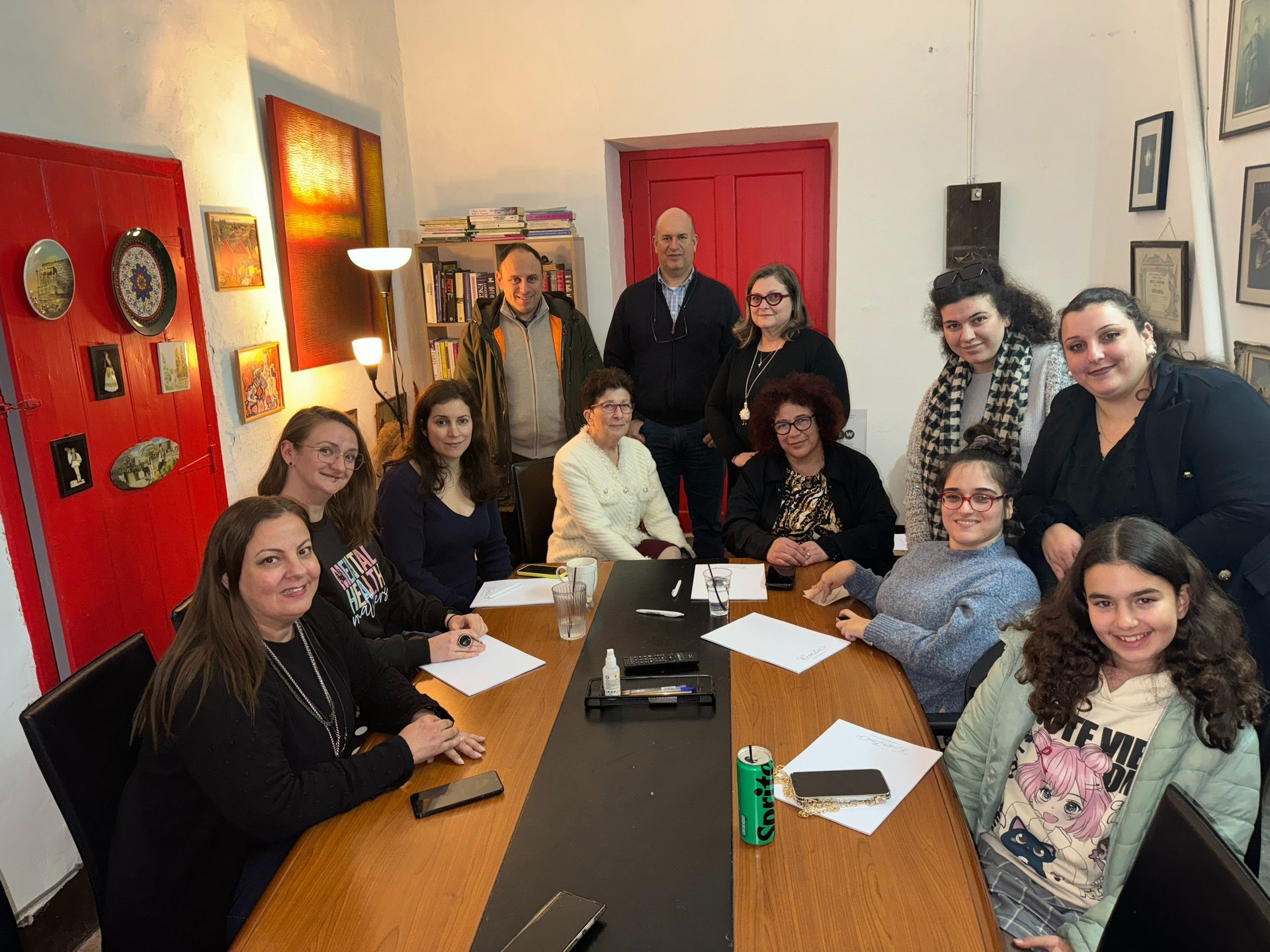 a group of people sitting around a table