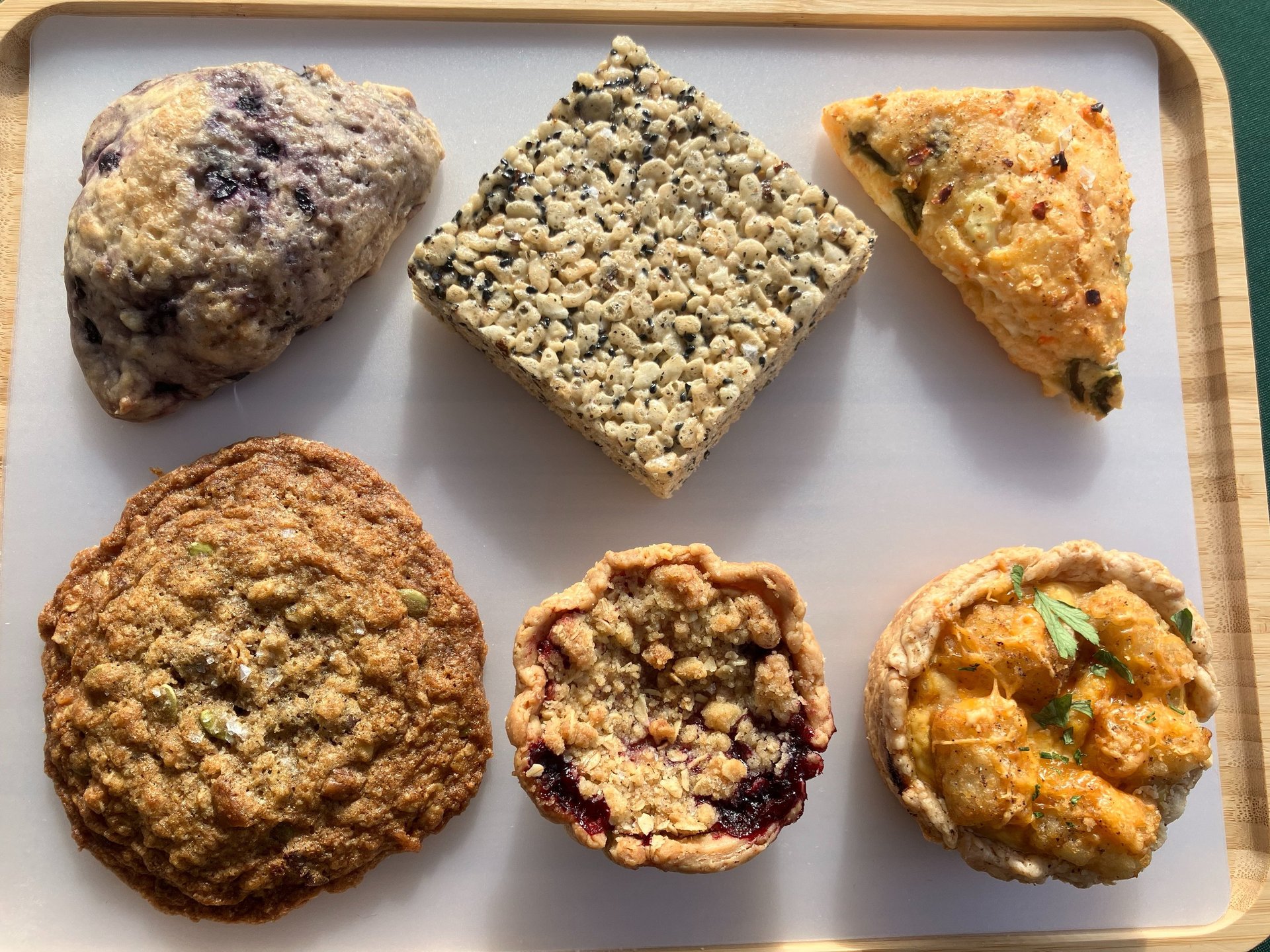 a tray of food and desserts on a tray