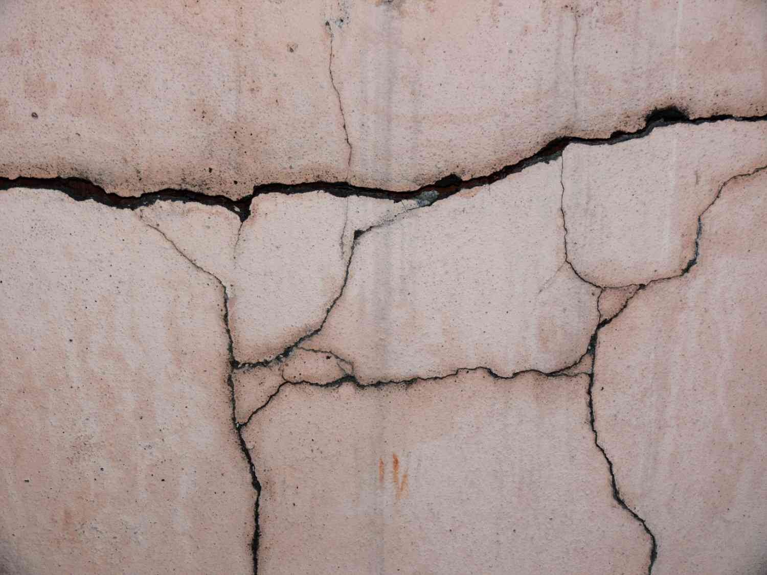 cracked foundation wall in Colorado Springs home showing moisture intrusion damage from repeated freeze thaw cycles creating
