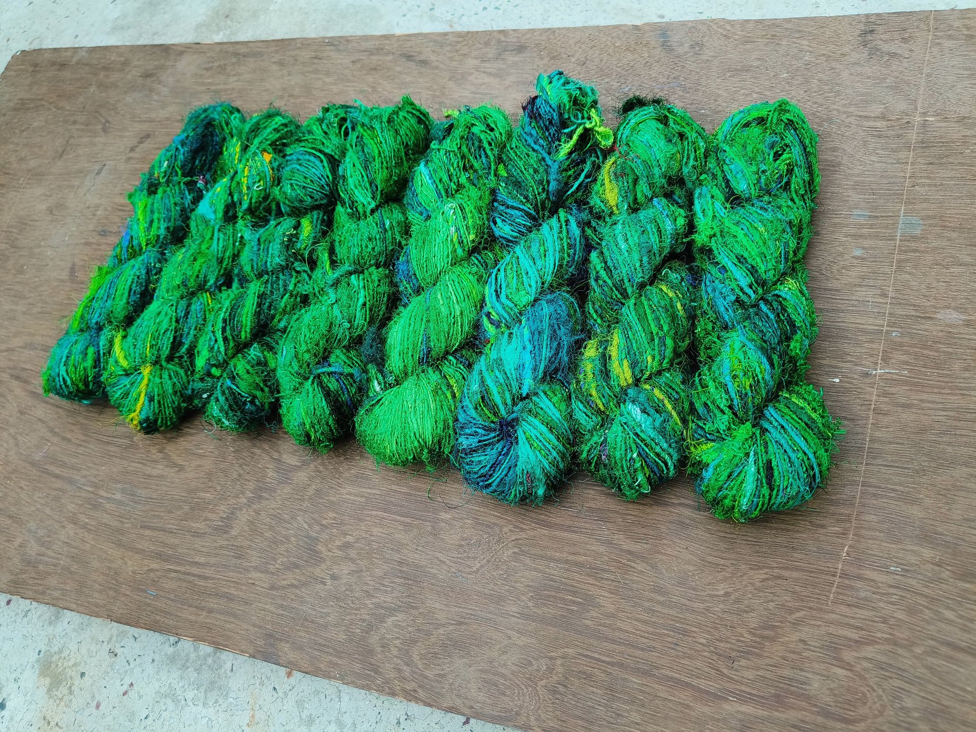 this is fine quality of recycled sari silk yarn. 125 meters of yarn in a 100 gram of skein. 