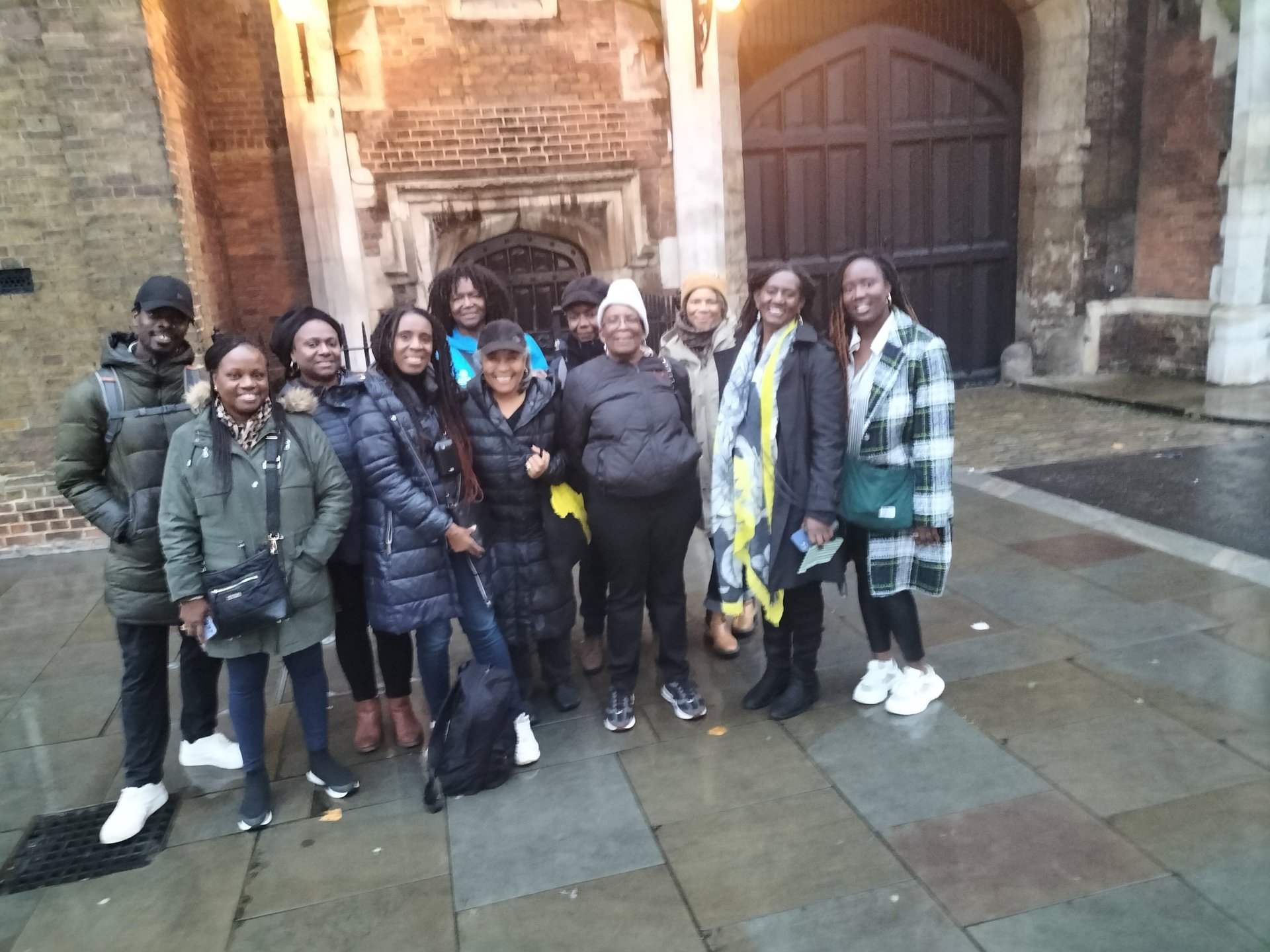 a group of people standing in front of St James's Palace