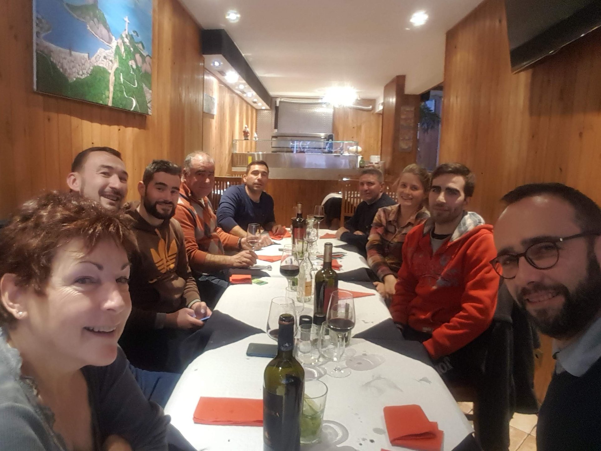 a group of people sitting around a table