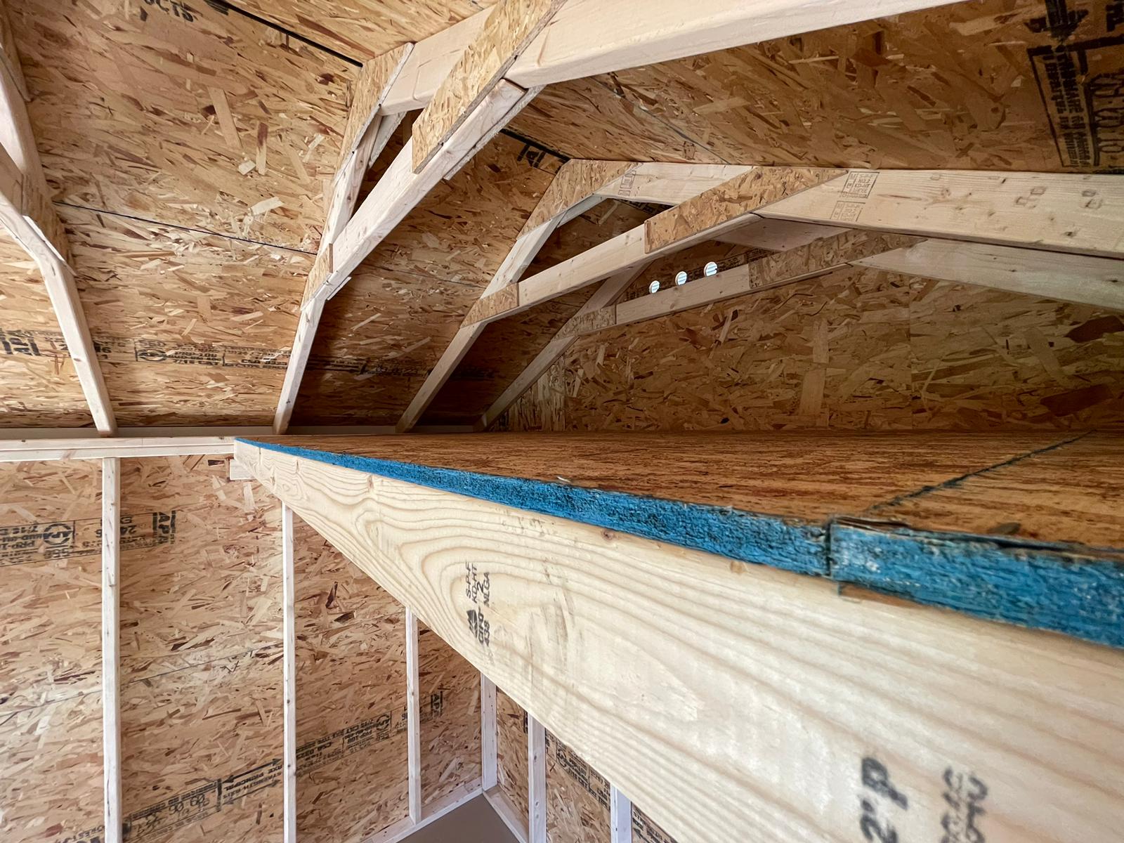 Custom shed with built-in loft for extra storage, handcrafted in Massachusetts and Rhode Island.