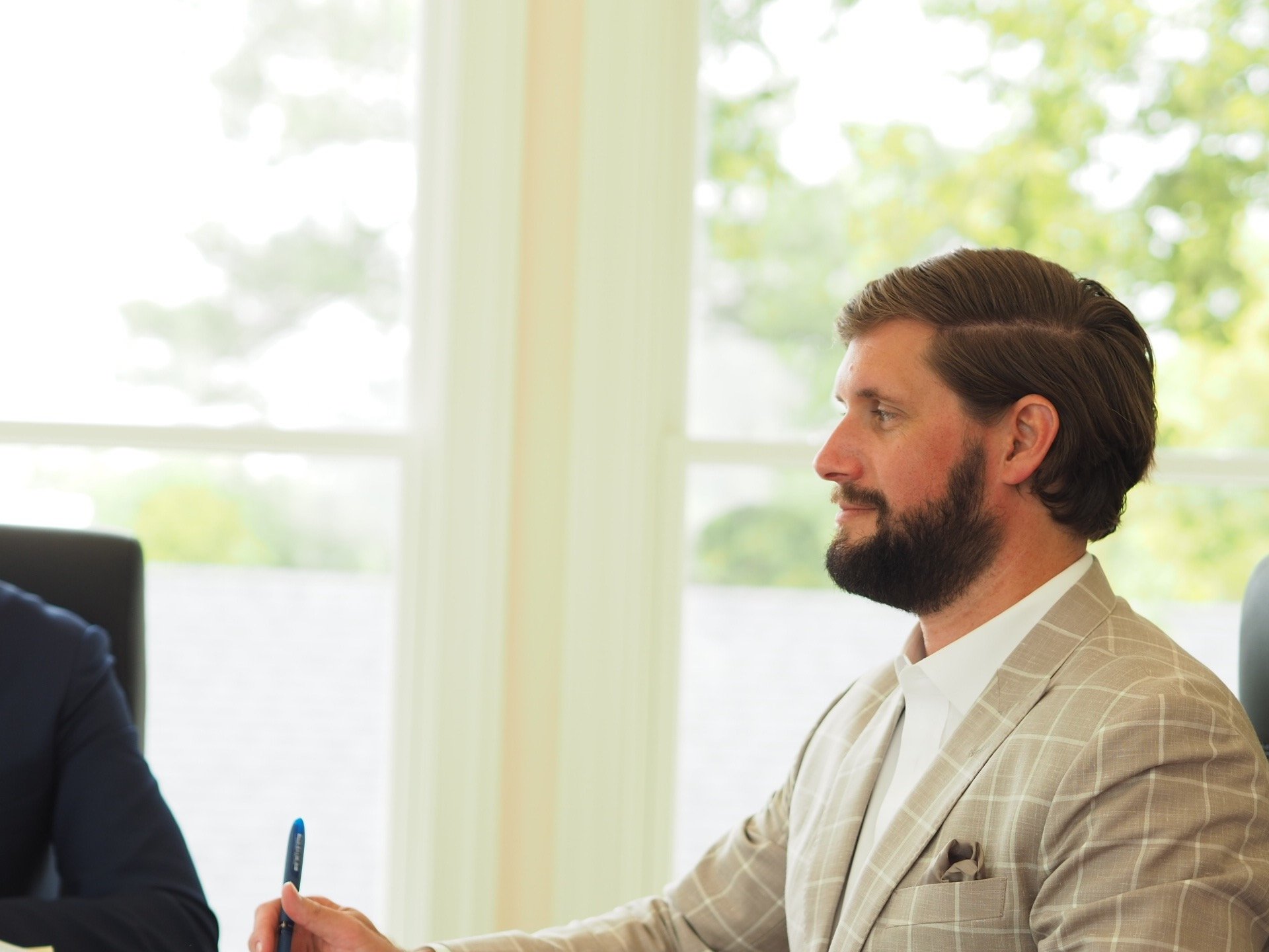 Arkansas Drug Crime Attorney Kyle Ludwig listens to a client during a free consultation. 
