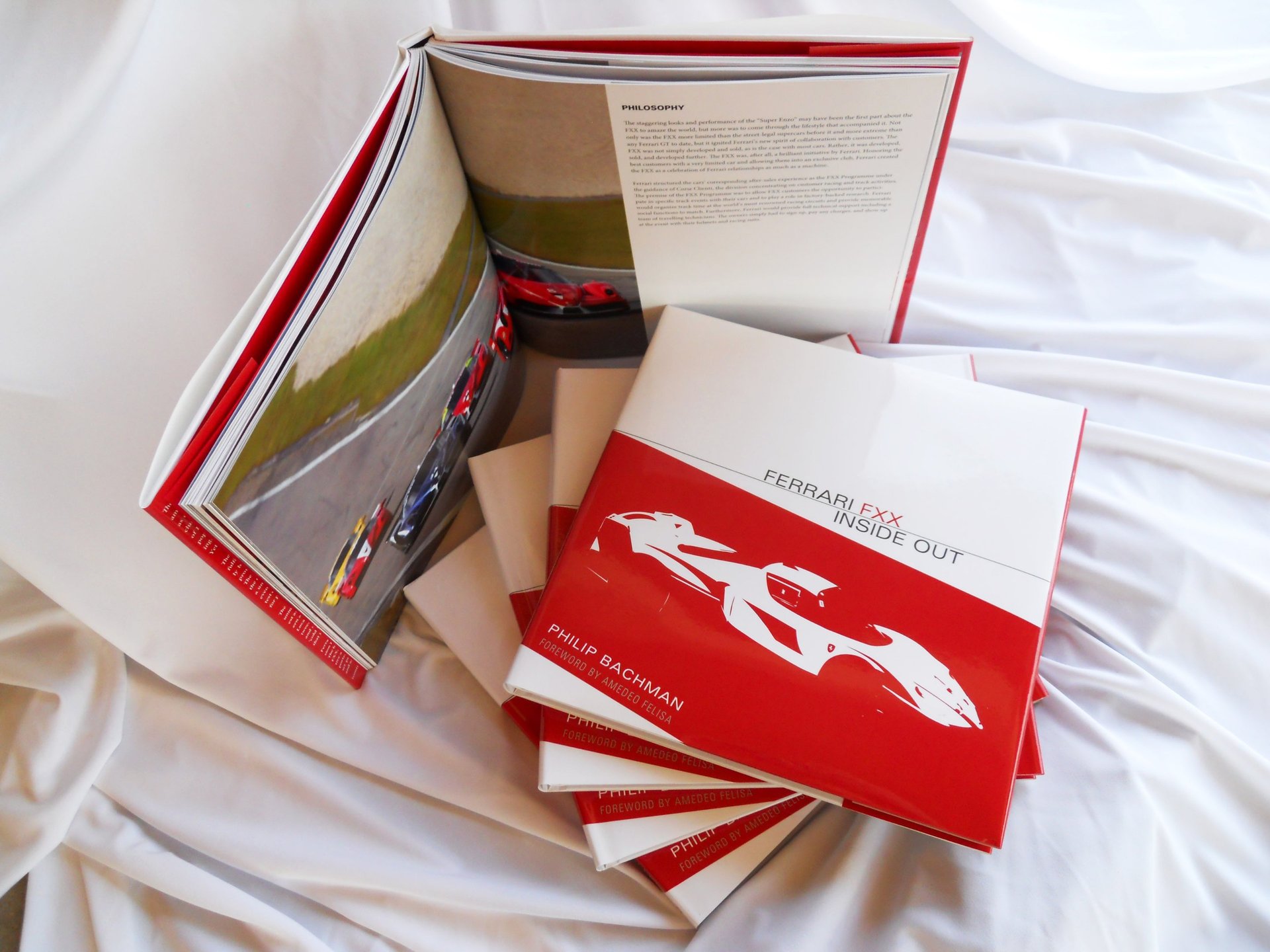 Ferrari FXX Inside Out - Book cover and stack of books