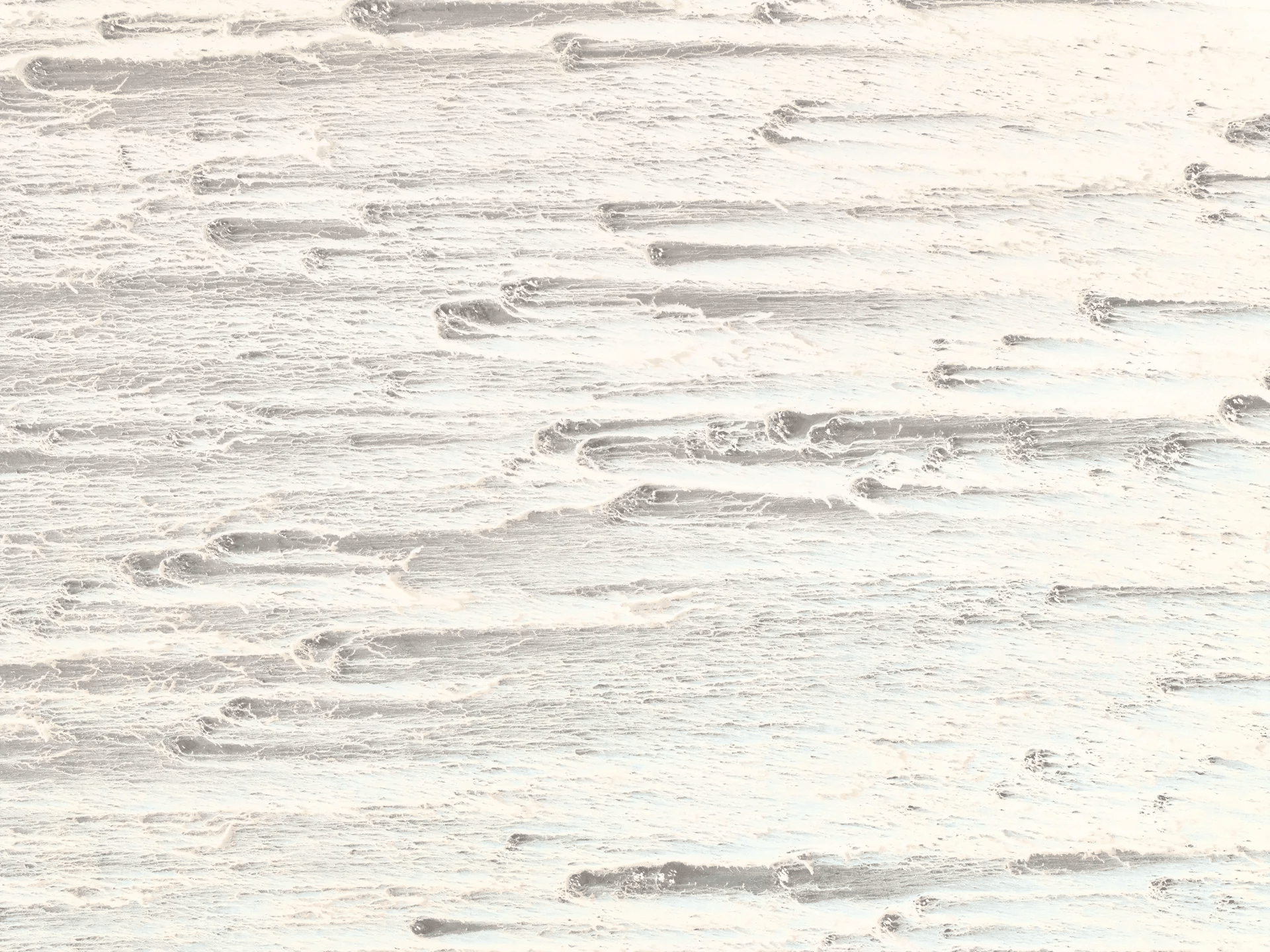 High-angle view of pale desert sand dunes, looking like a weathered wood grain texture.