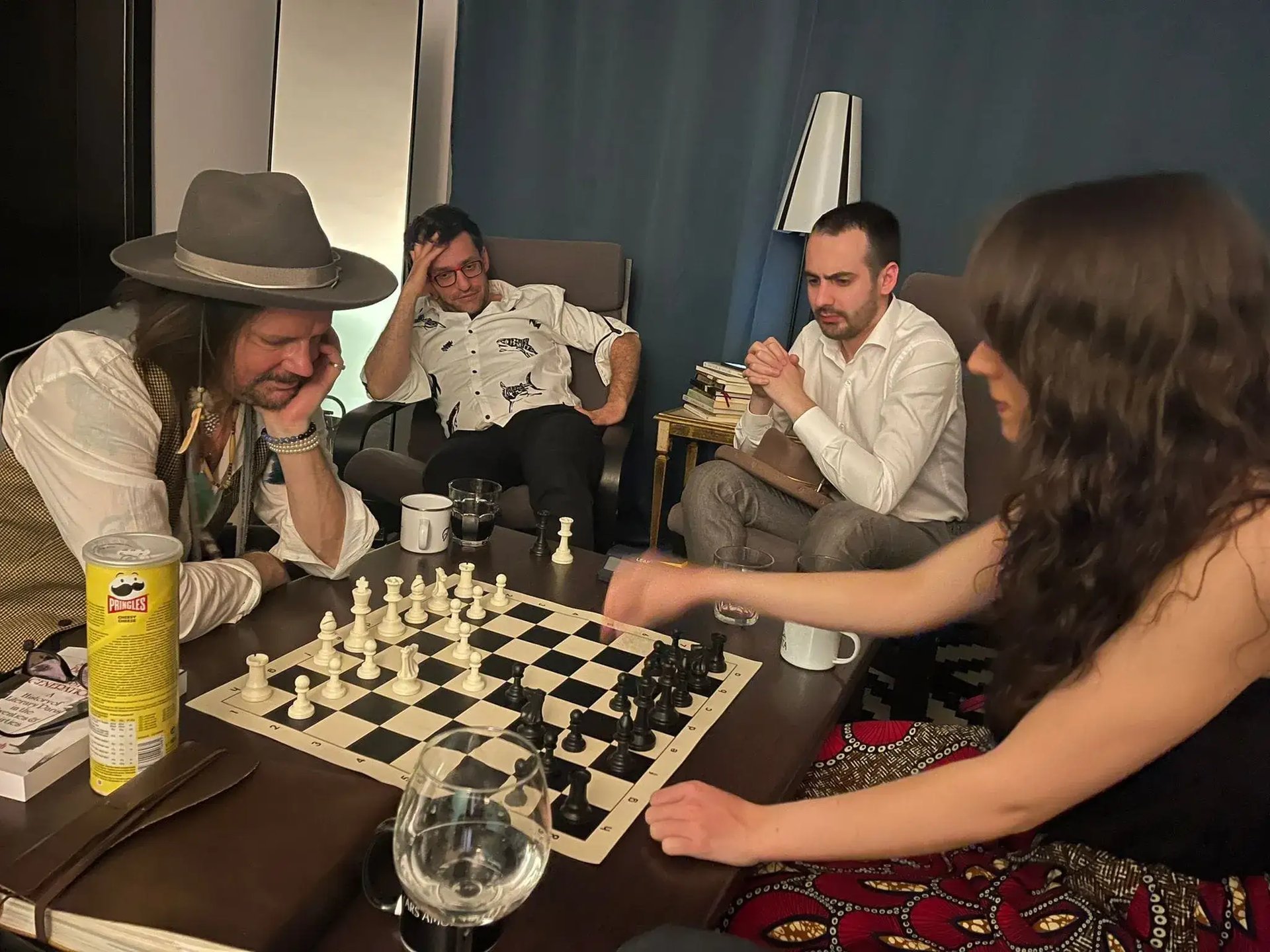 Levon Aronian and Vlad Ghita overlooking a casual chess game in Bucharest