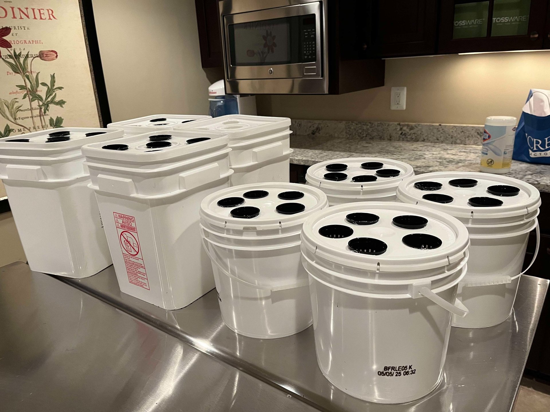 Hydroponic grow buckets on a table
