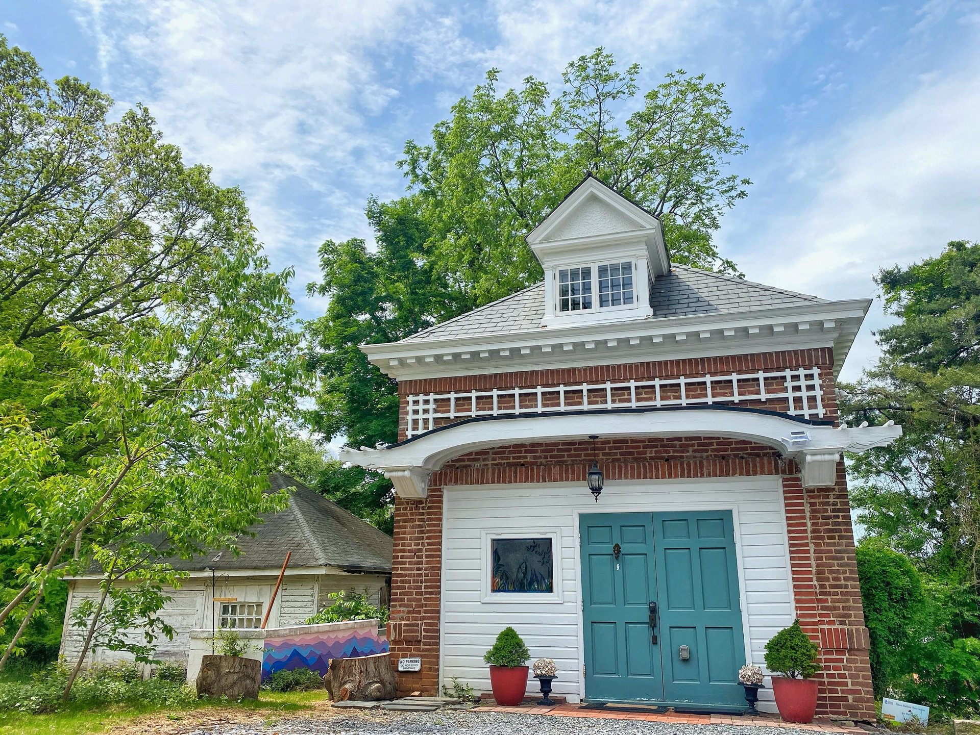 2123 rivermont carriage house with green door and white awning