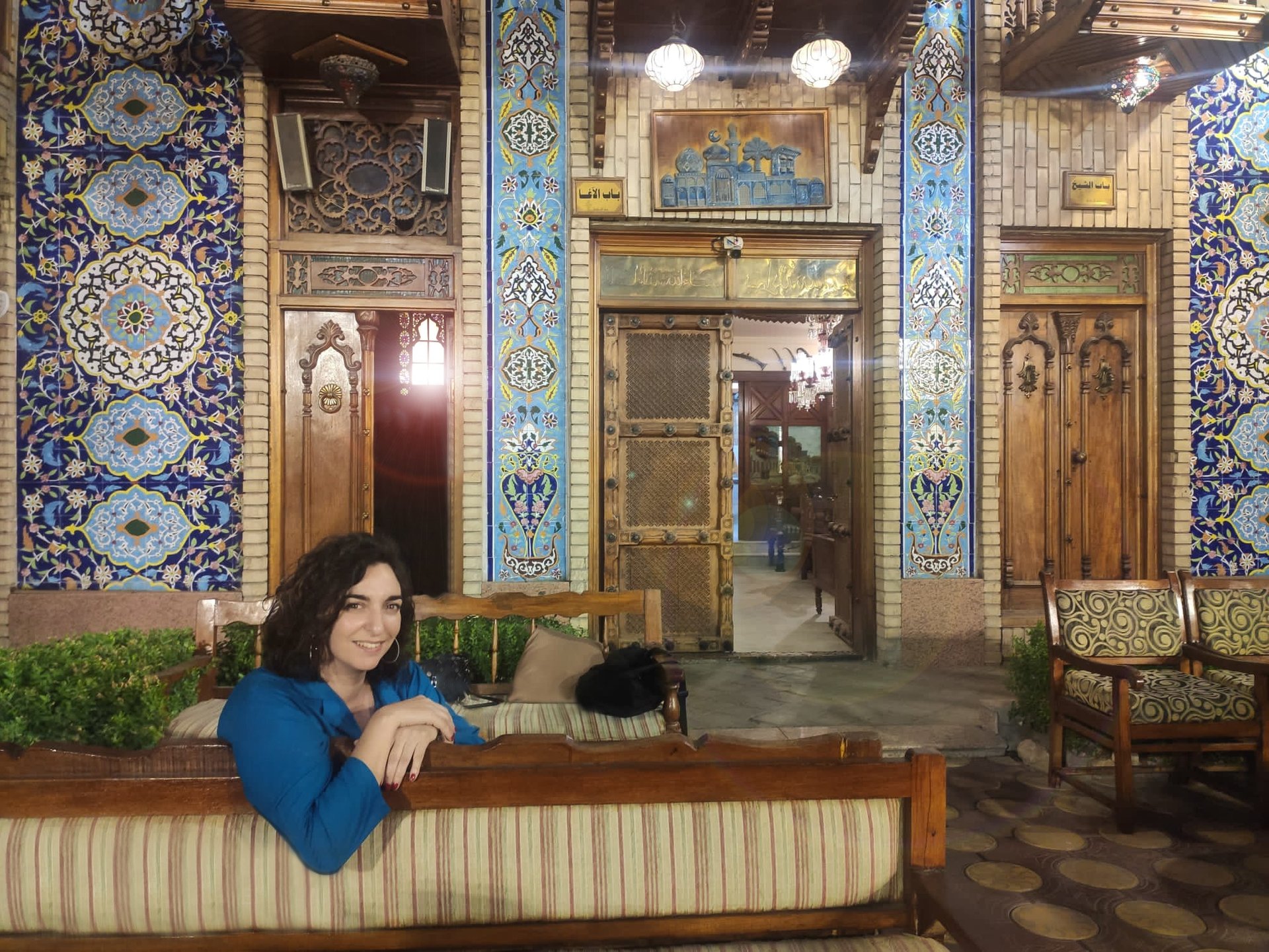 a woman sitting on a couch in a room