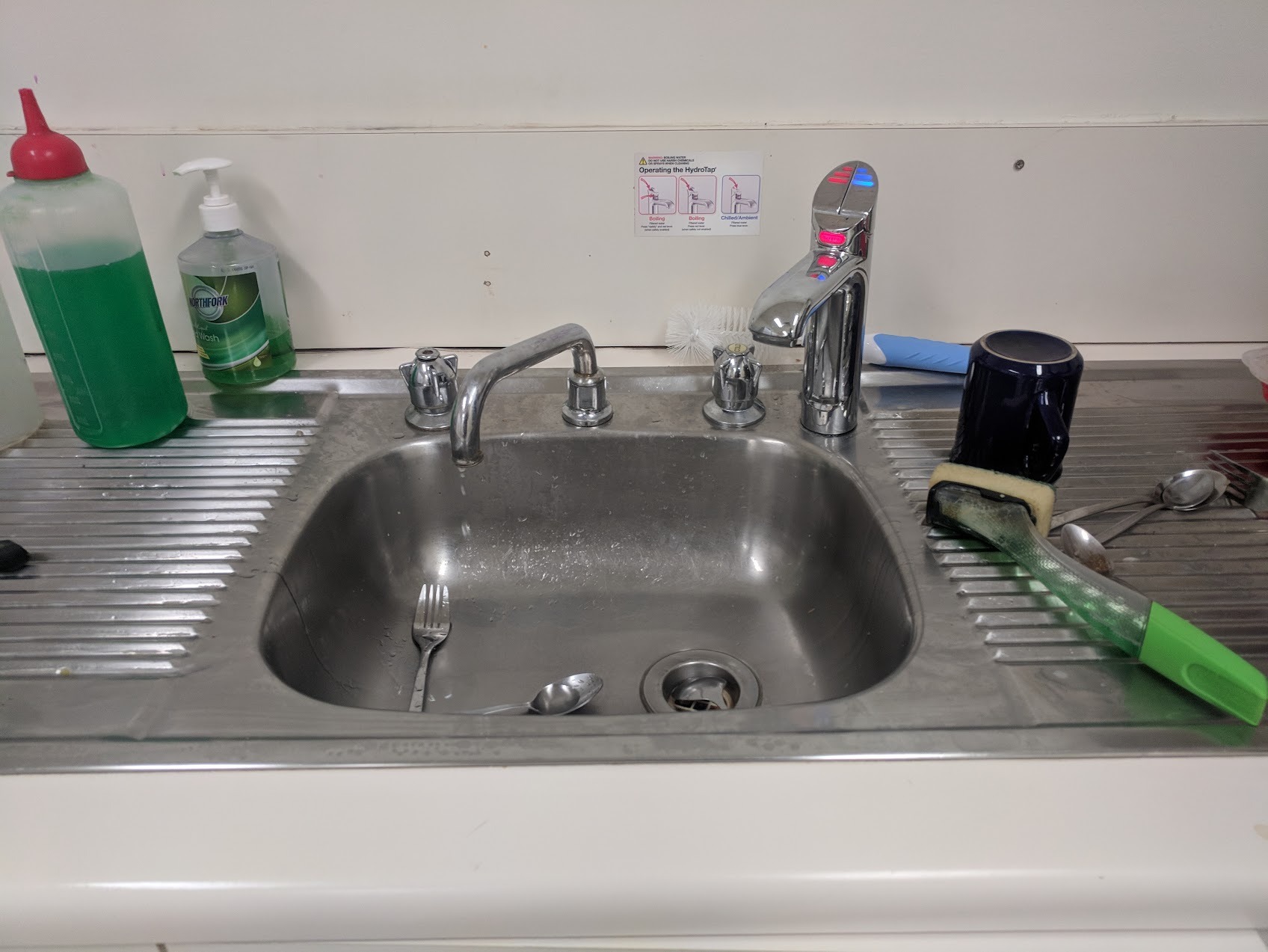 old leaking kitchen sink taps