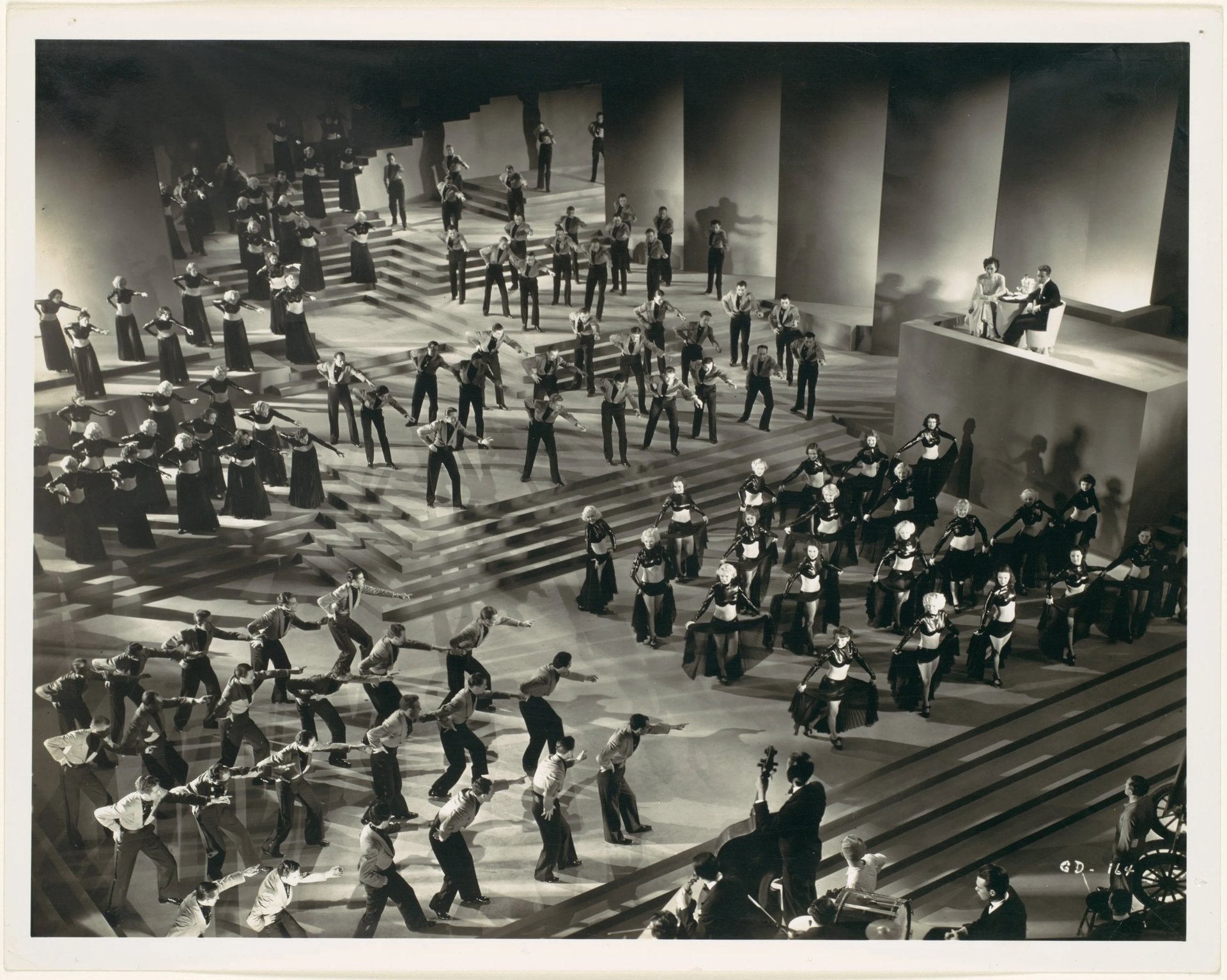 Overhead three‑quarter shot of Gold Diggers of 1935 “Lullaby of Broadway” with dancers in grouped fo