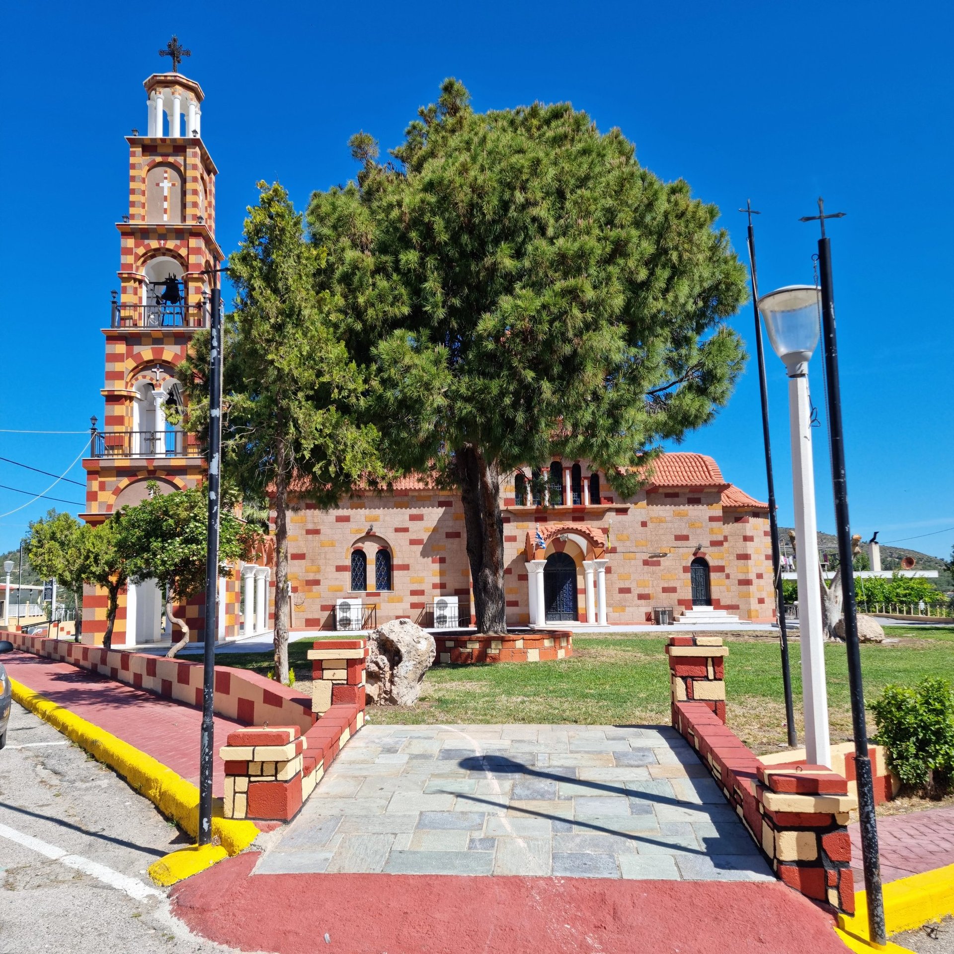 a church with a clock tower in the background
