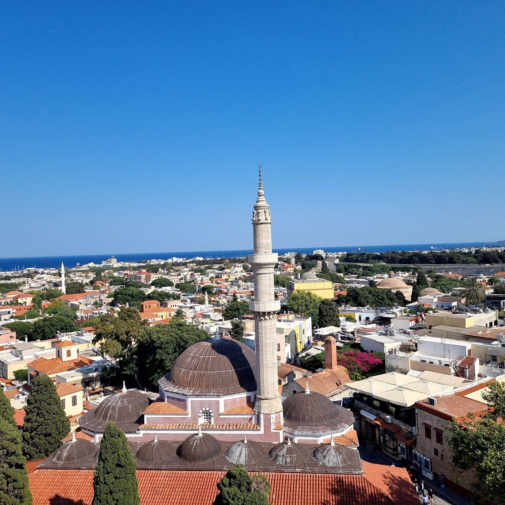Panoramic aerial view of the Sulemaniye Mosque and old town architecture in Rhodes, Greece.