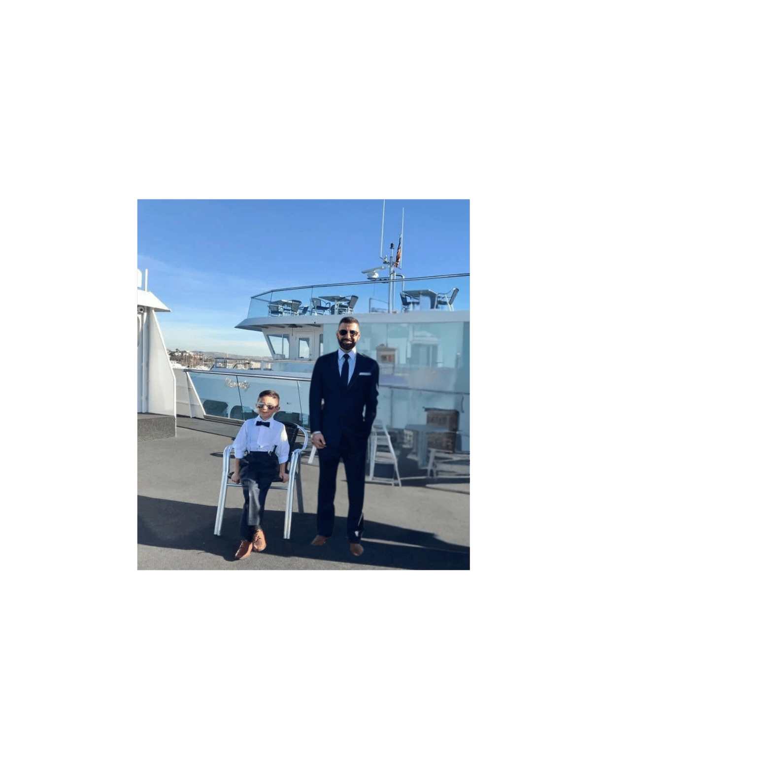 a man in a suit and tie standing next to a woman in a suit