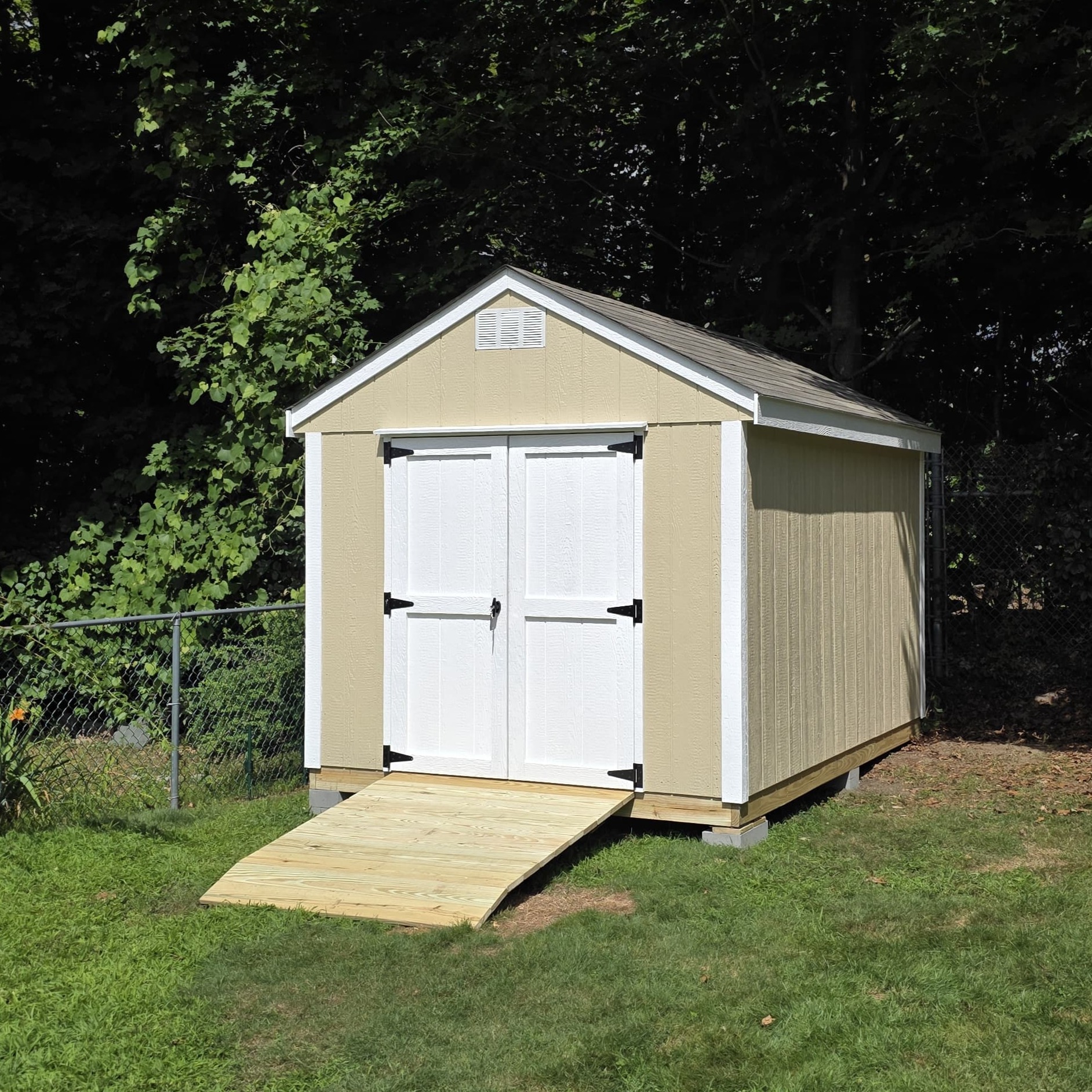 8x12 wooden storage shed with robust construction and classic design for spacious outdoor storage.