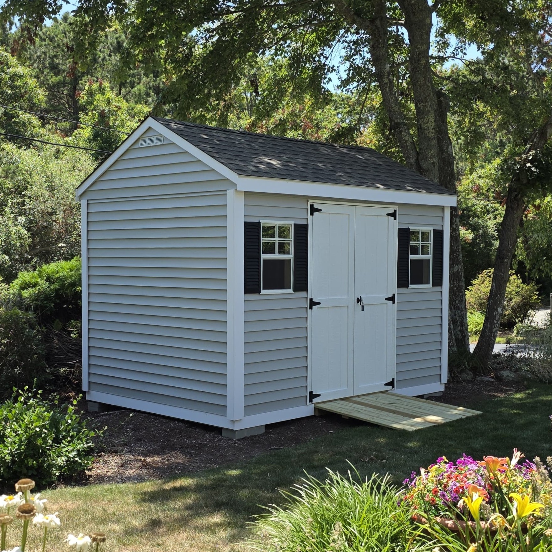 Decorative frieze bottom trim on custom shed built in Massachusetts, enhancing shed appearance with elegant finishing detail.