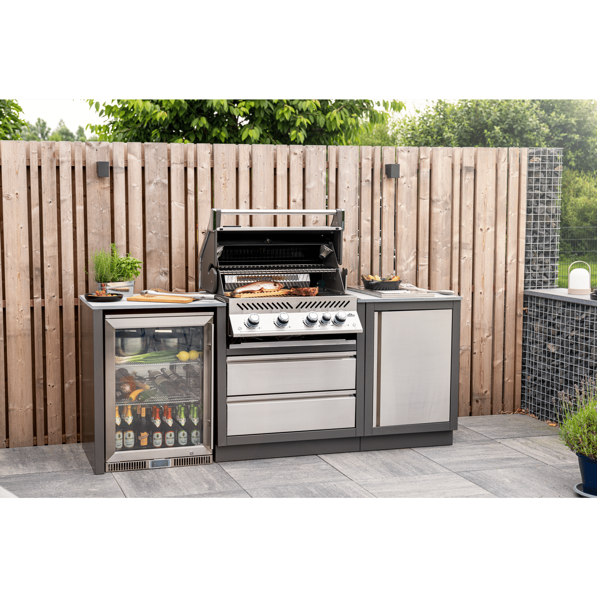 Custom Napoleon Oasis kitchen configuration with an under counter fridge and storage drawers