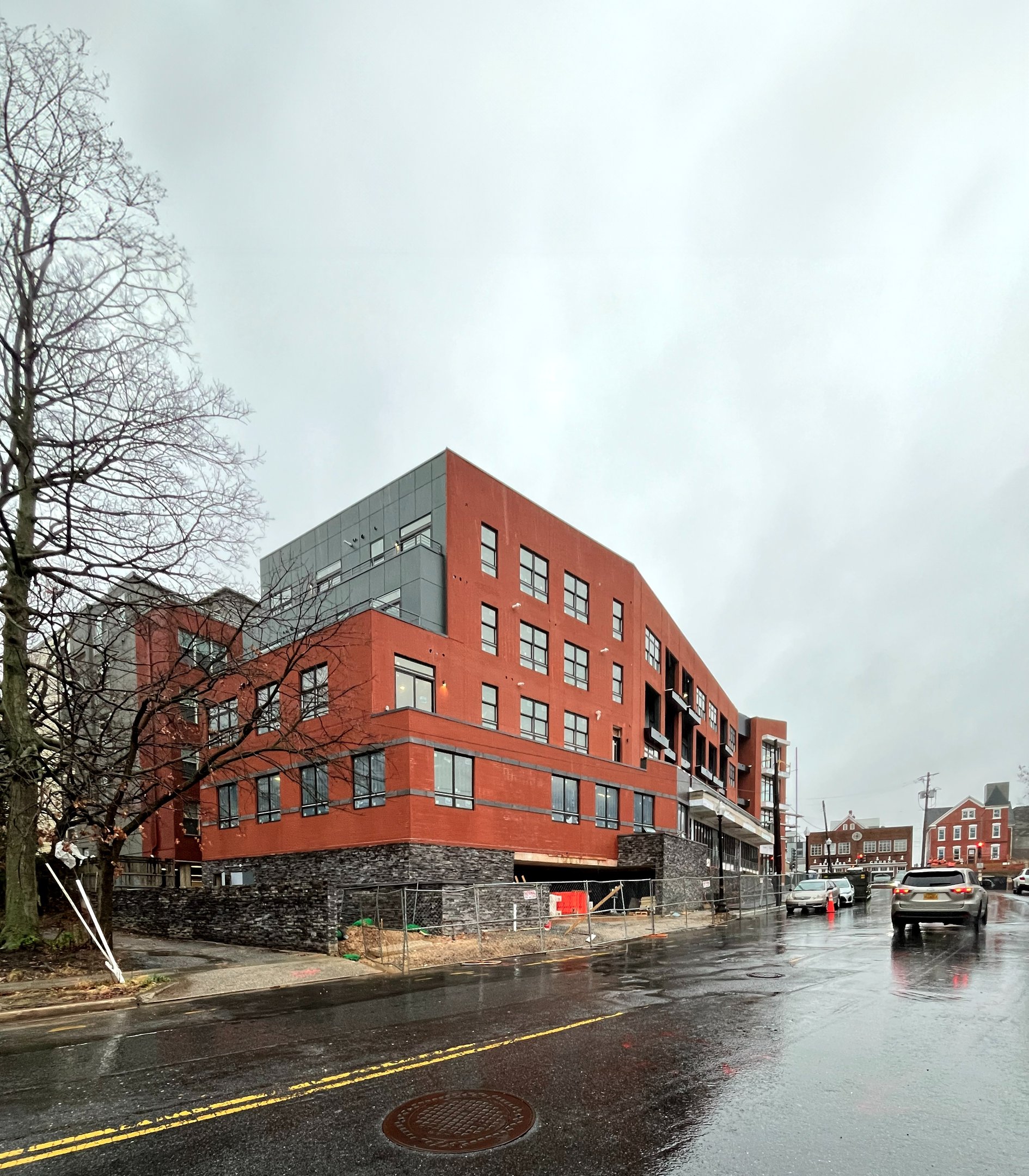 A photograph of a red brick apartment building