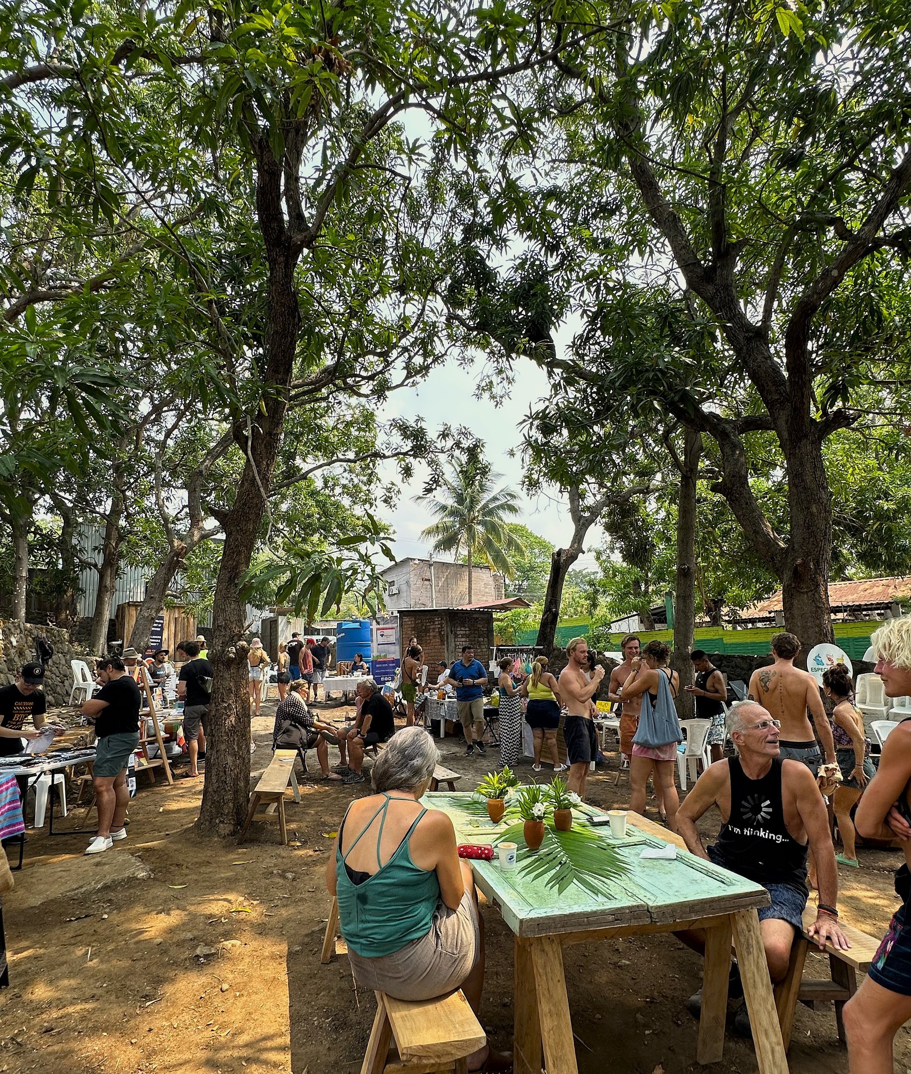 farmers market event with people standing and talking