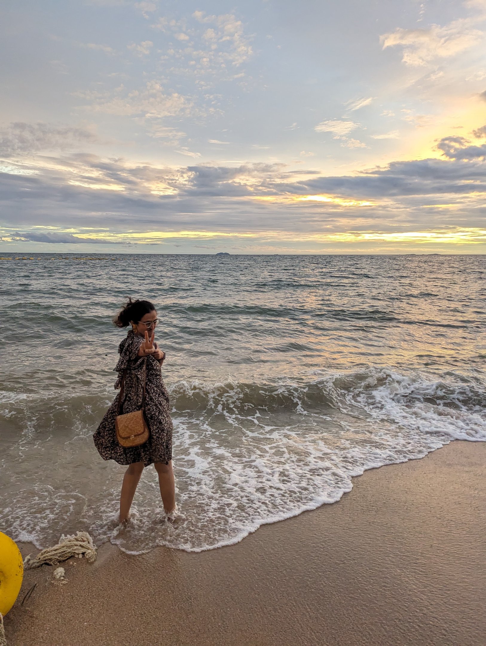 Riya, a human copywriter posing at the beach