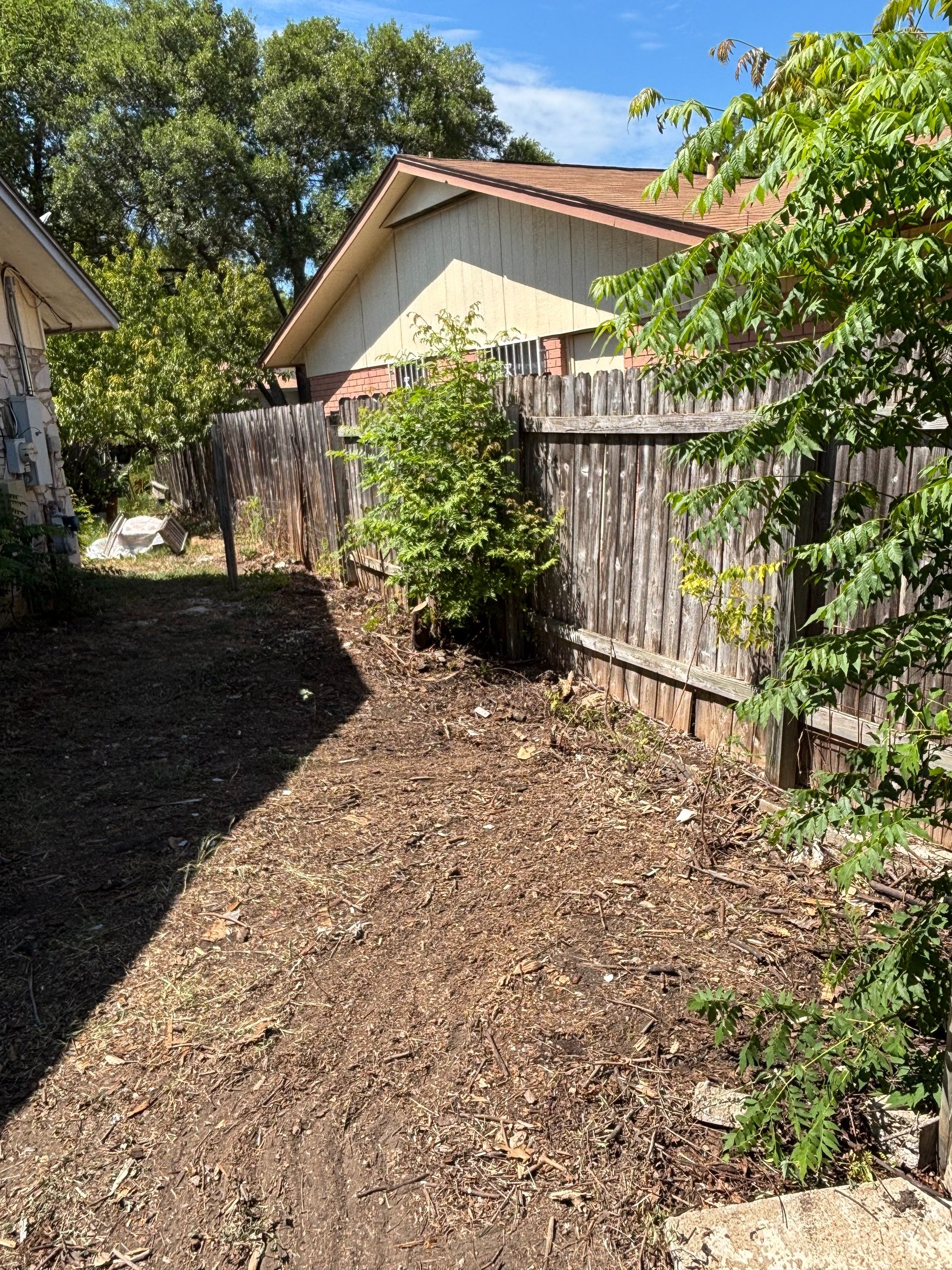 a clean and decluttered backyard after junk removal in fair oaks ranch