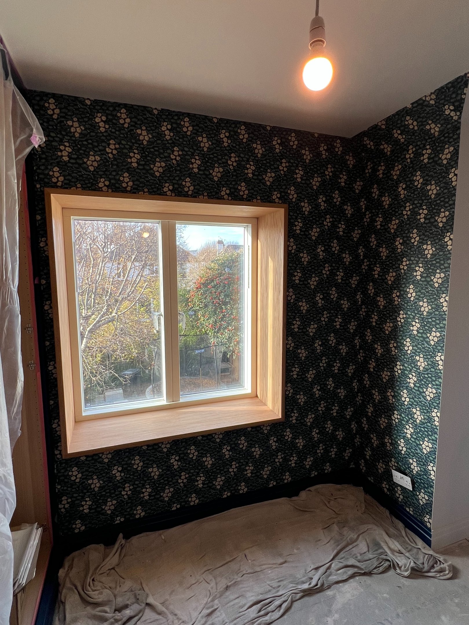 Portslade renovation with floral patterned wallpaper, an oak window frame.