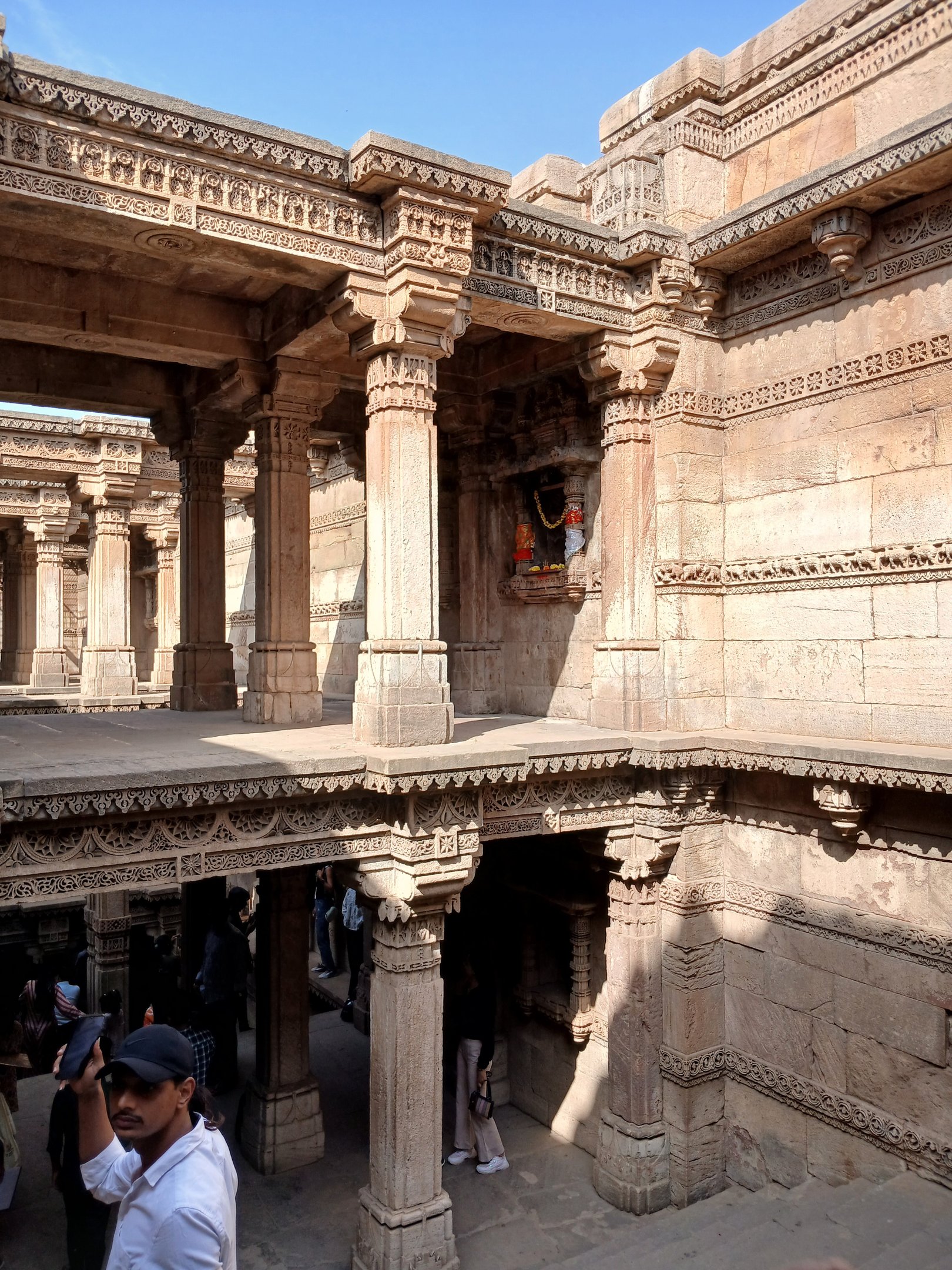 Ornate stone pillars and galleries of Adalaj Stepwell, Gujarat