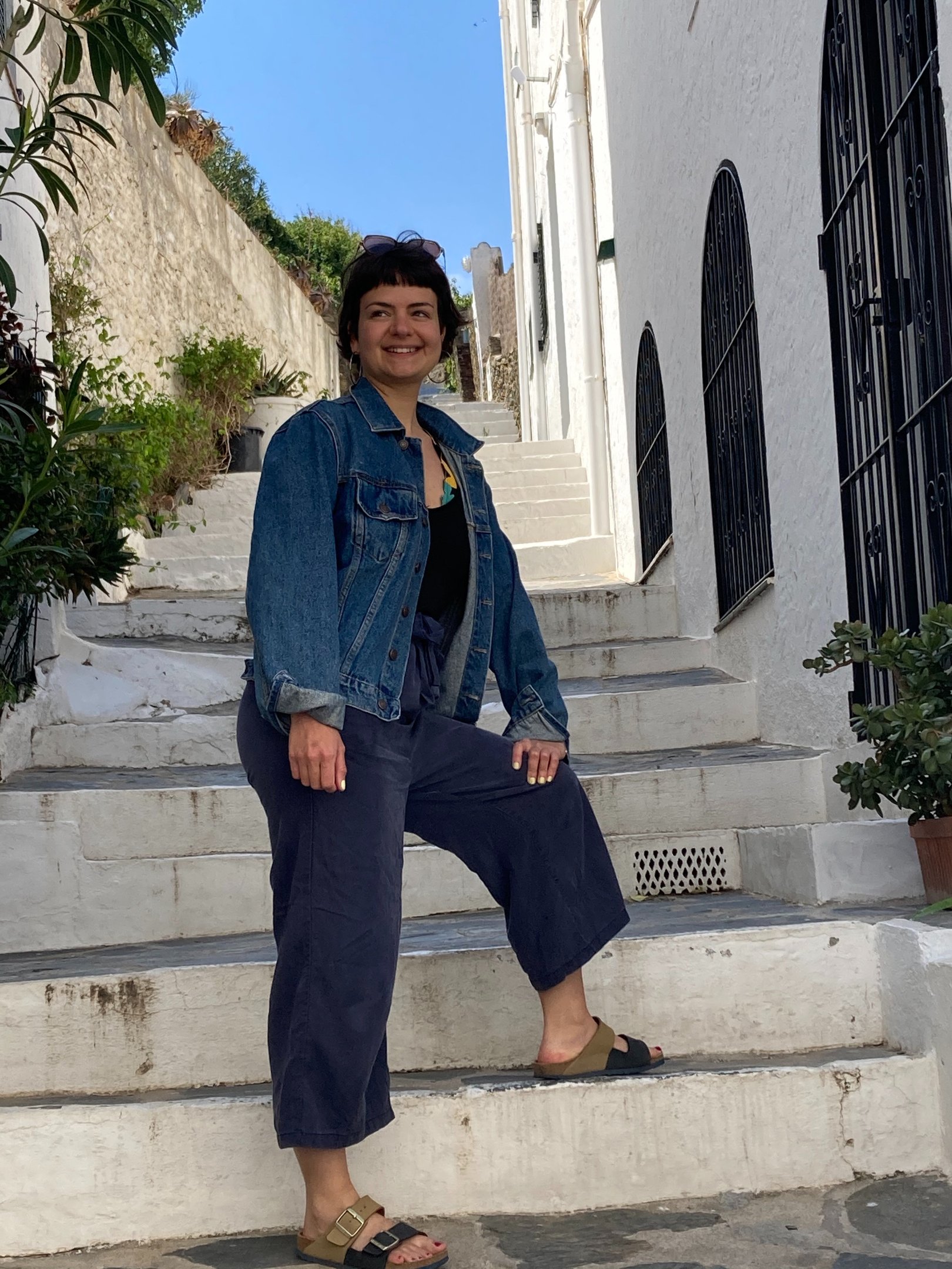 a woman in a denim jacket and jeans jacket