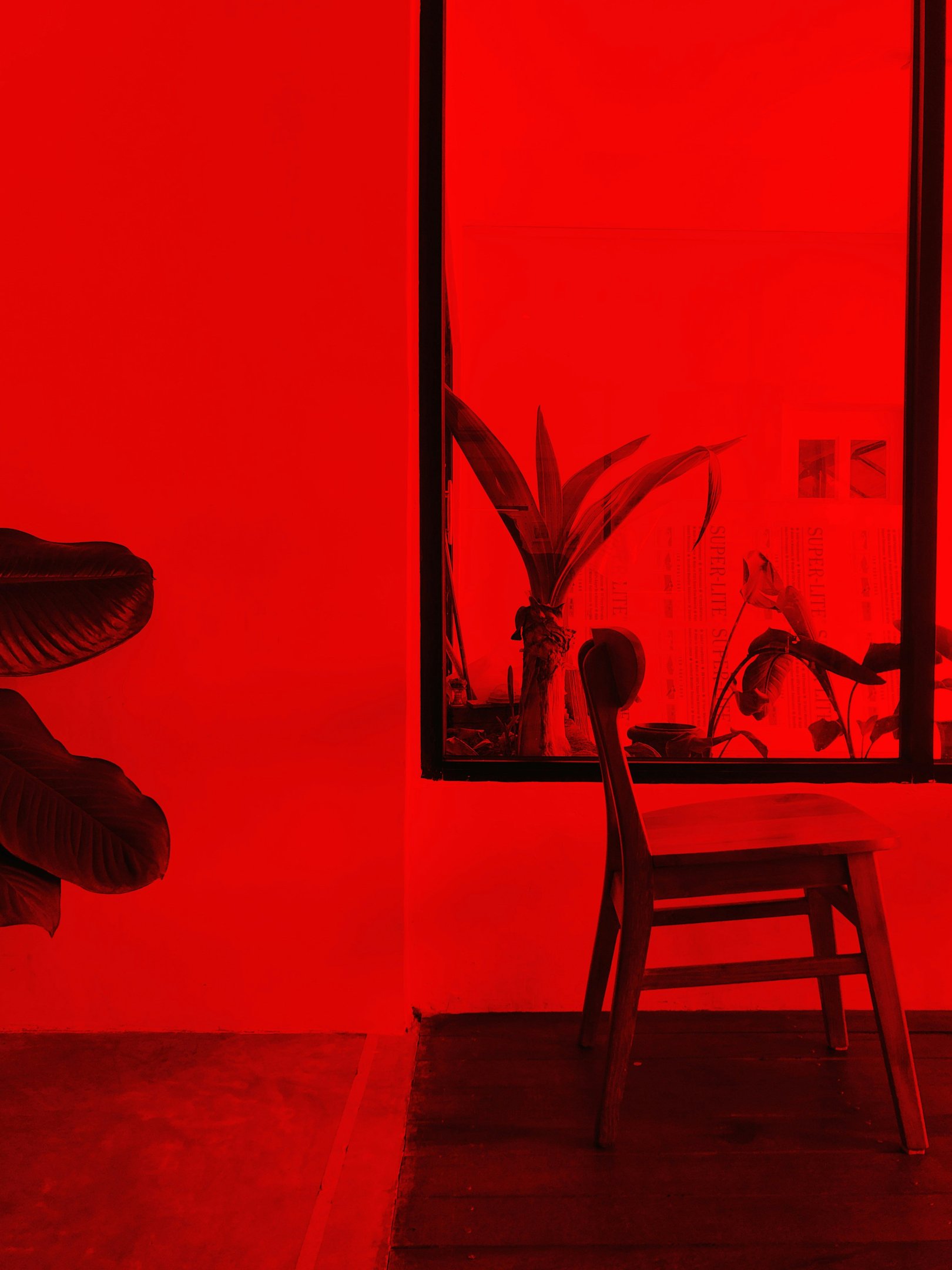 a chair in a room with red light