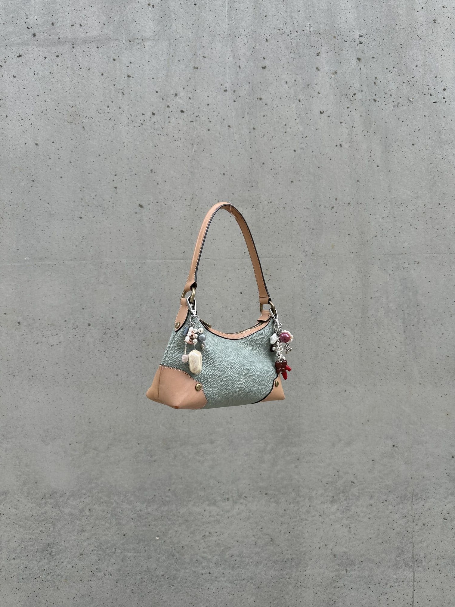 Elegant handbag featuring fun.arc.ik bag charms crafted from pearls and beads, women's accessories