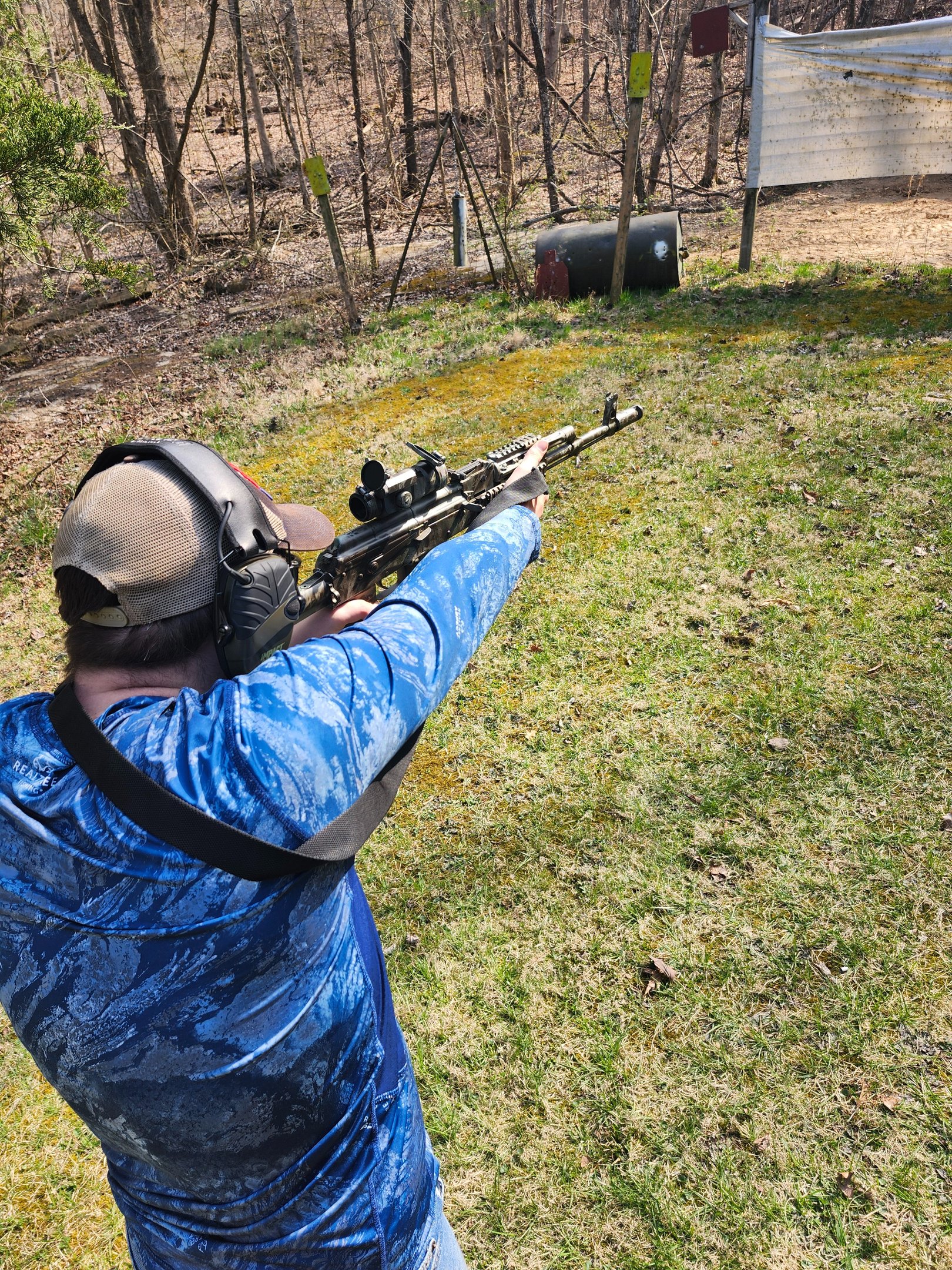 Man using self-defense firearm on range.