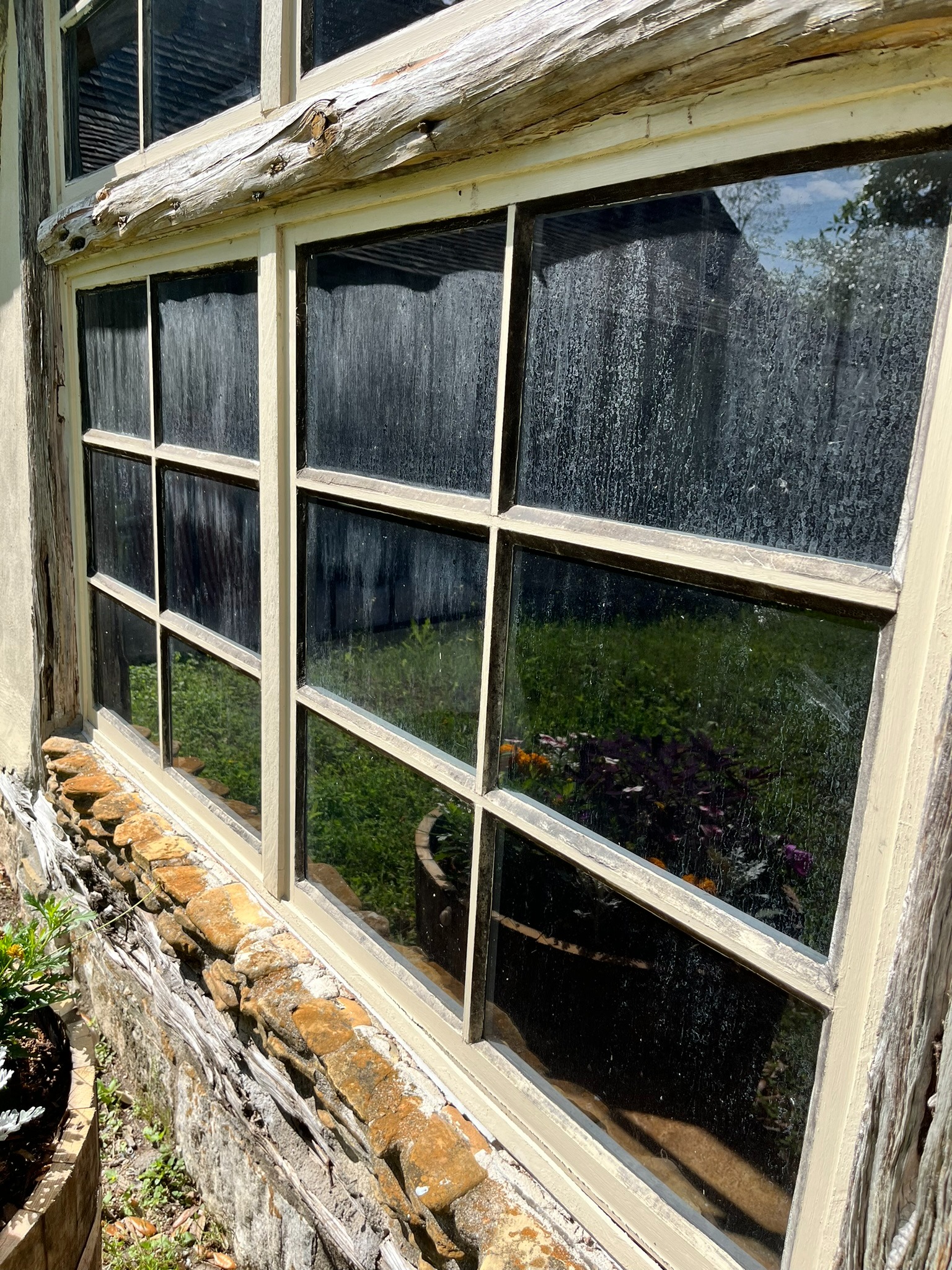 Hard water stains on Hill Country windows cleaned by Elegant Restorations in San Antonio, TX