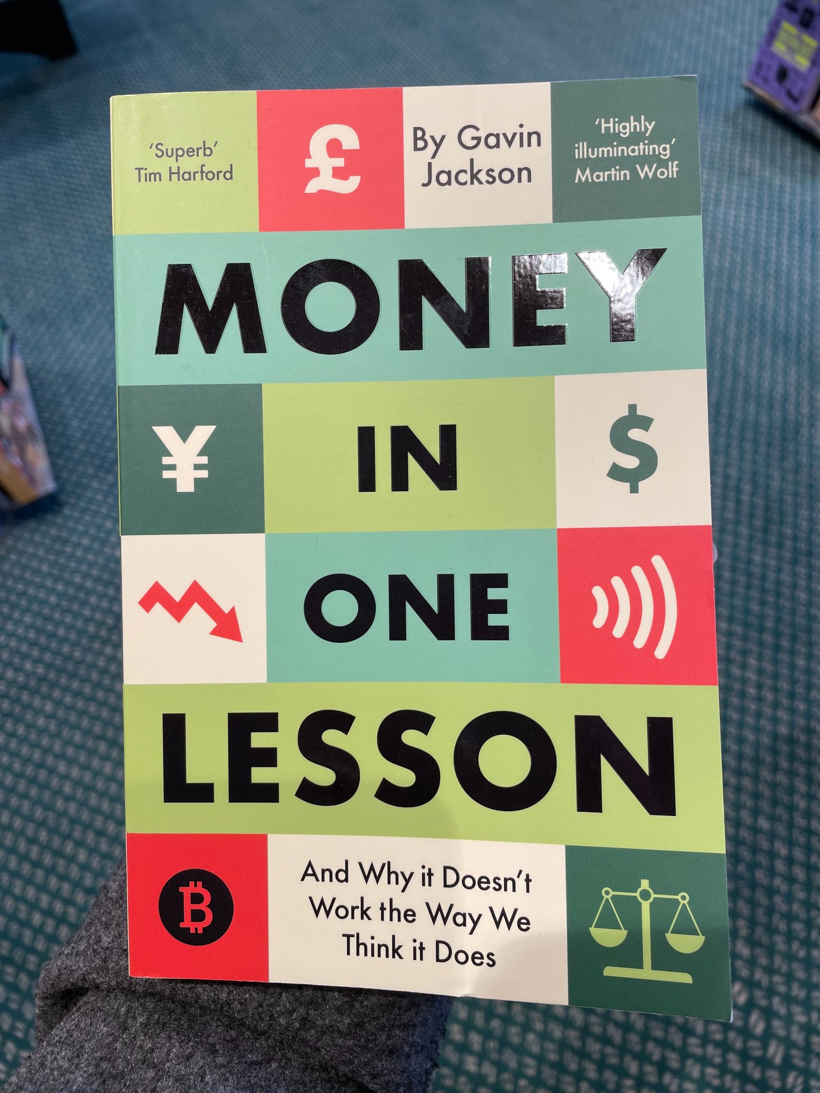 a person holding a book about money
