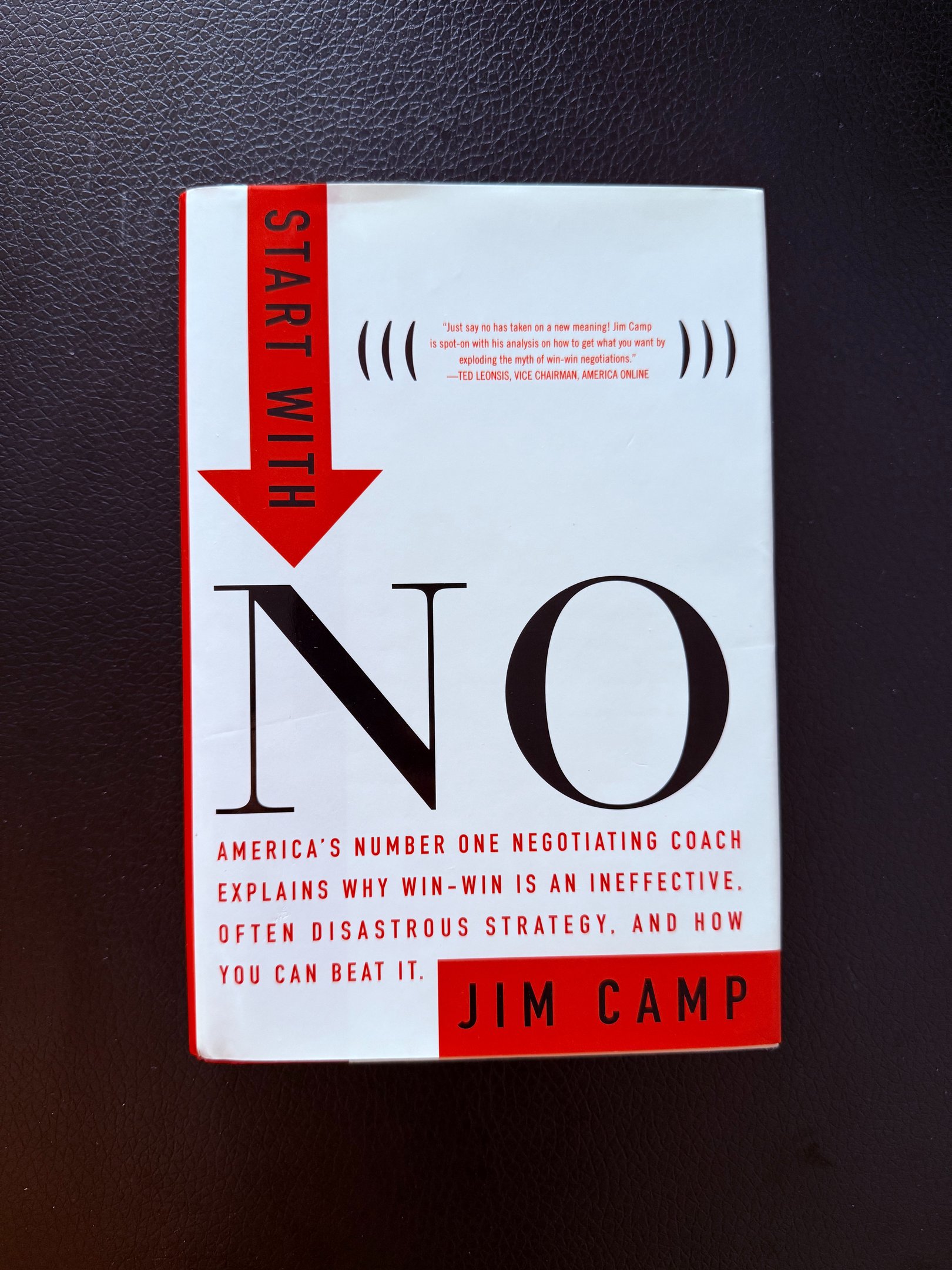 a book cover of a book with a red arrow pointing up