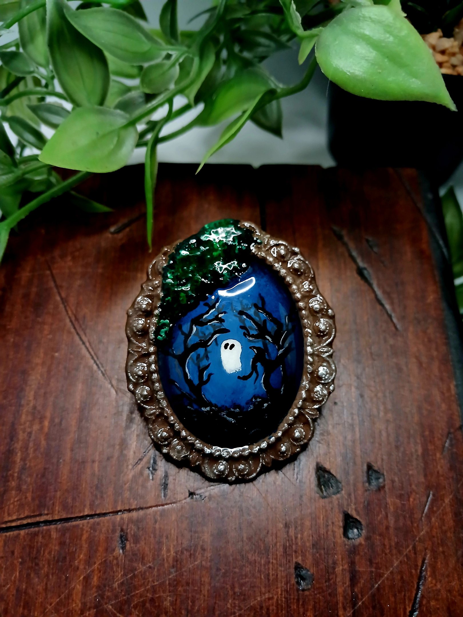 Handmade miniature ghost painting in a vintage frame with spooky trees and green moss.